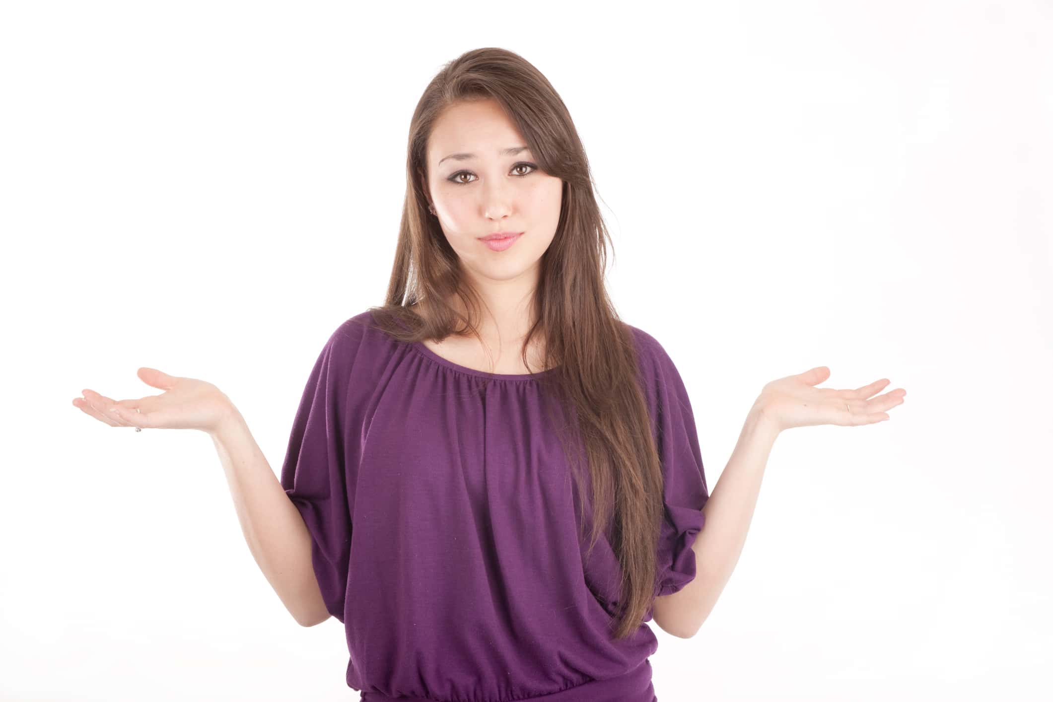 Young girl posing with her palms up.