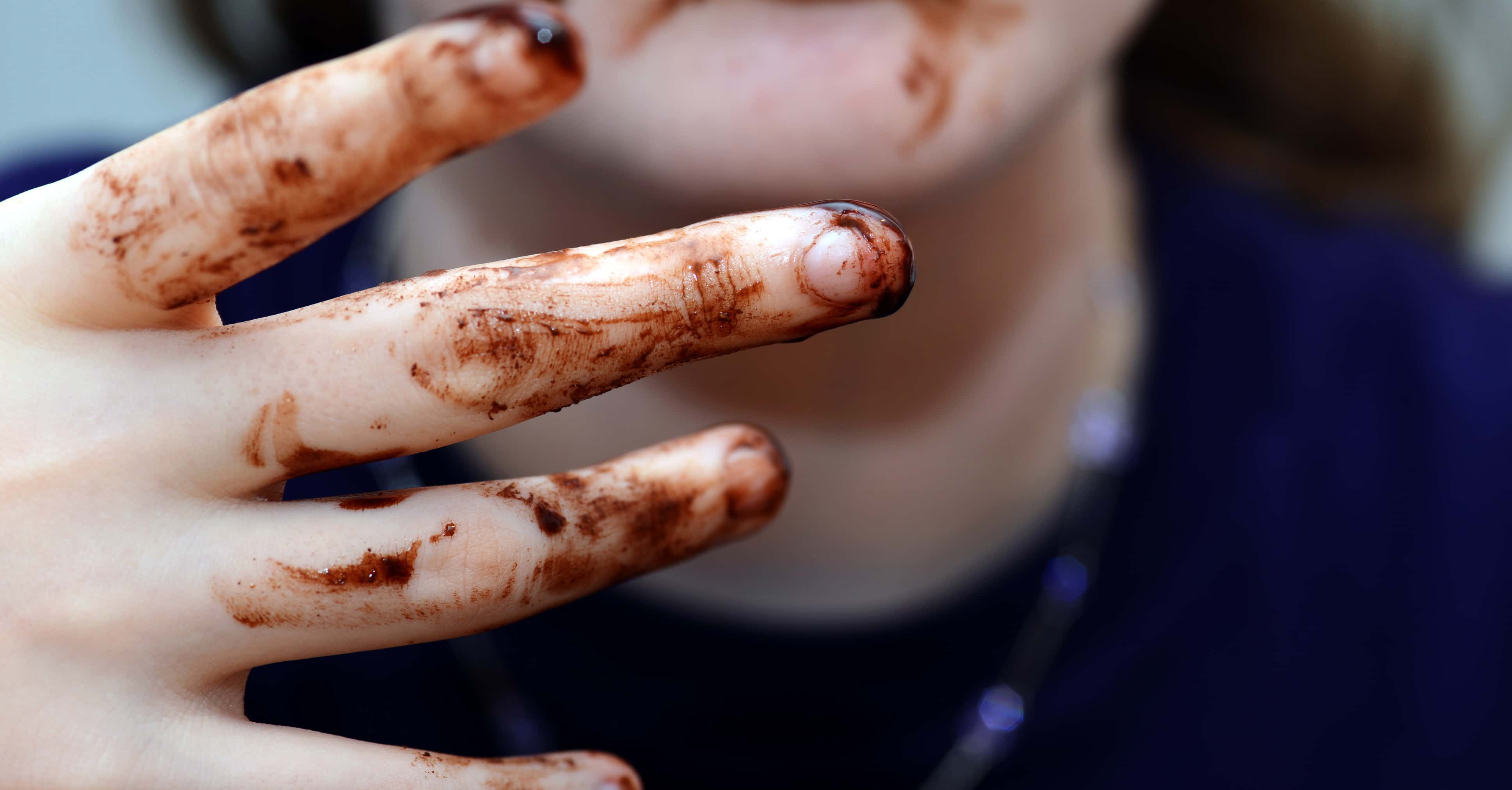 Girl eating chocolate.