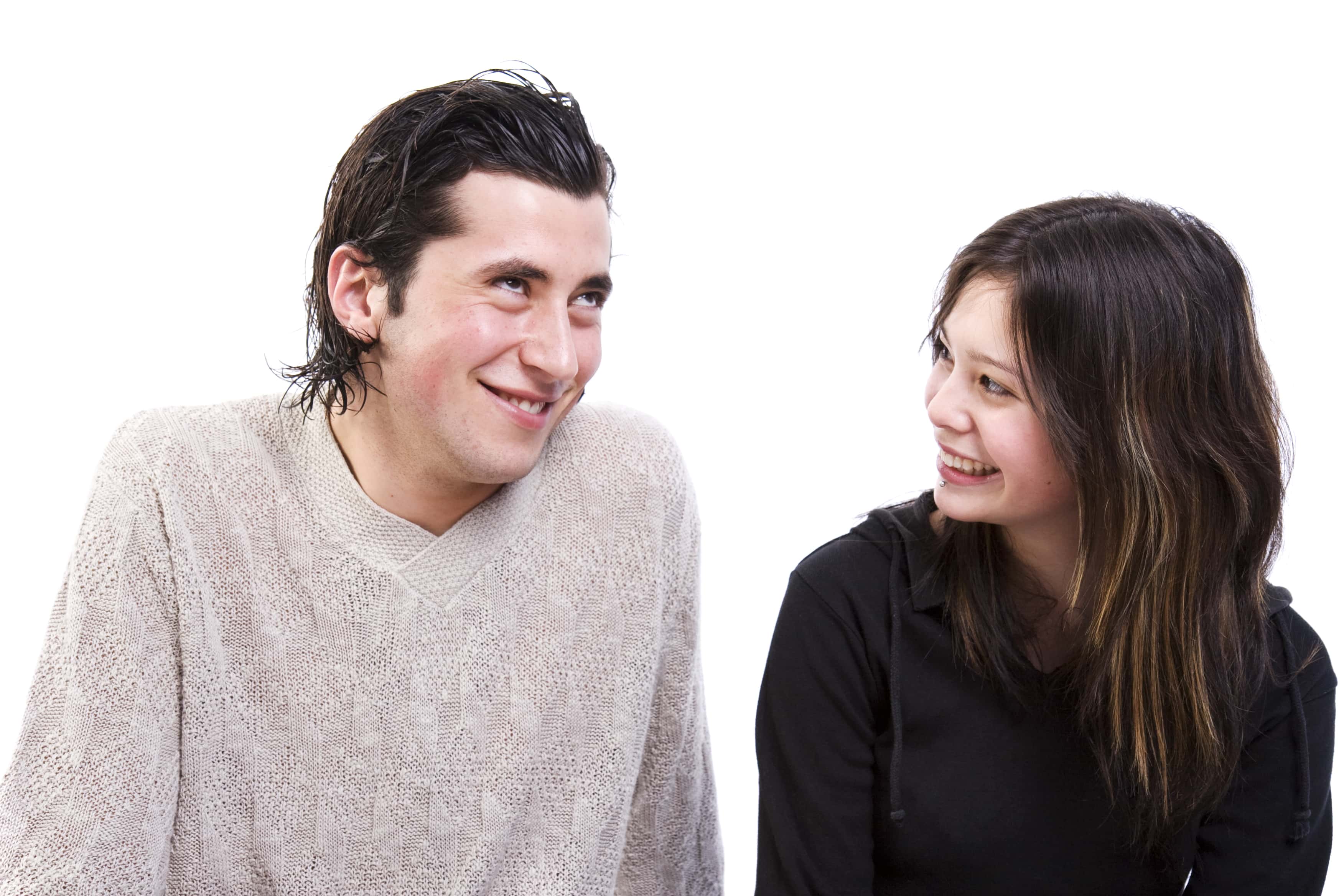 Young couple chatting and smiling.