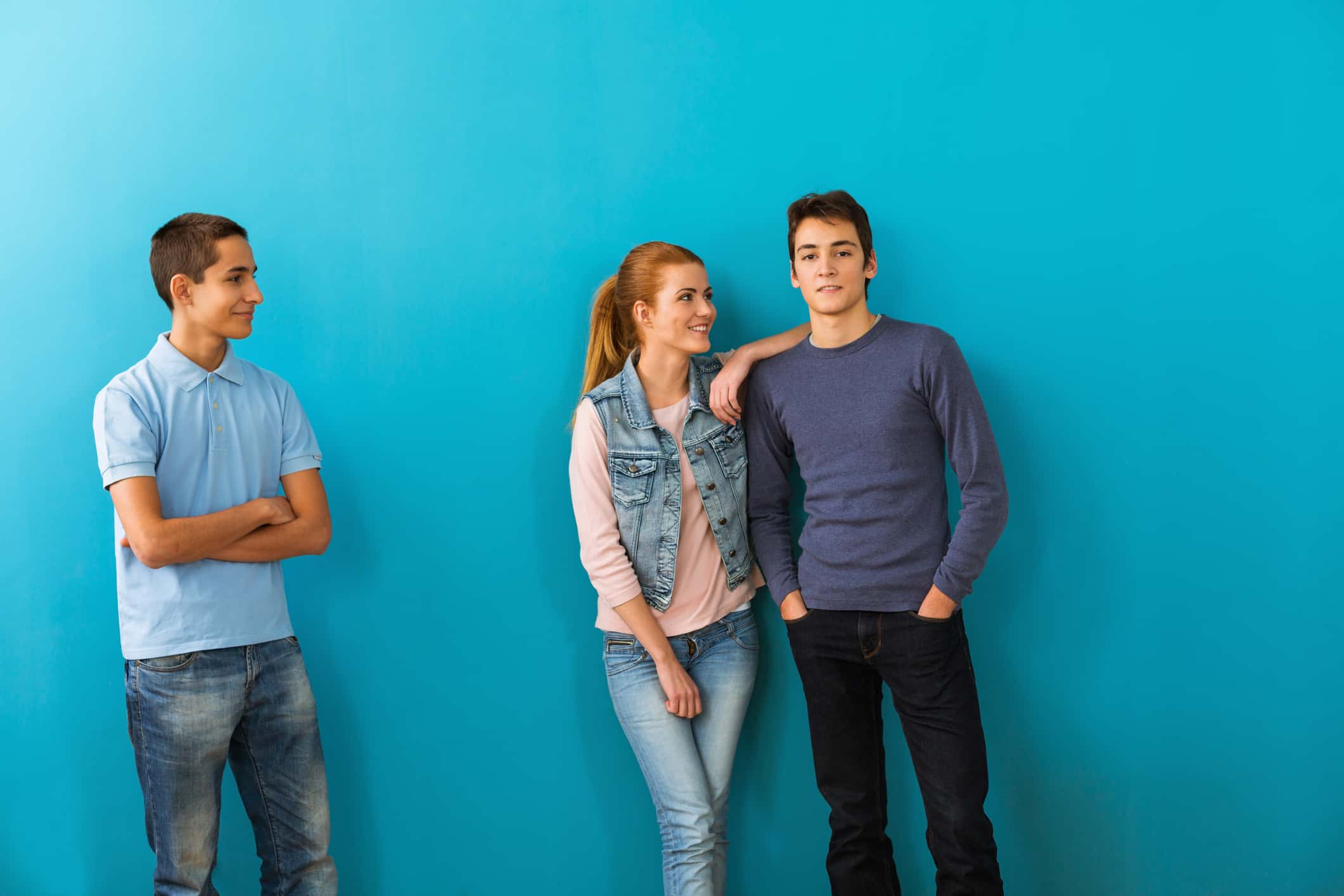 Teenage boy looking at couple in love.