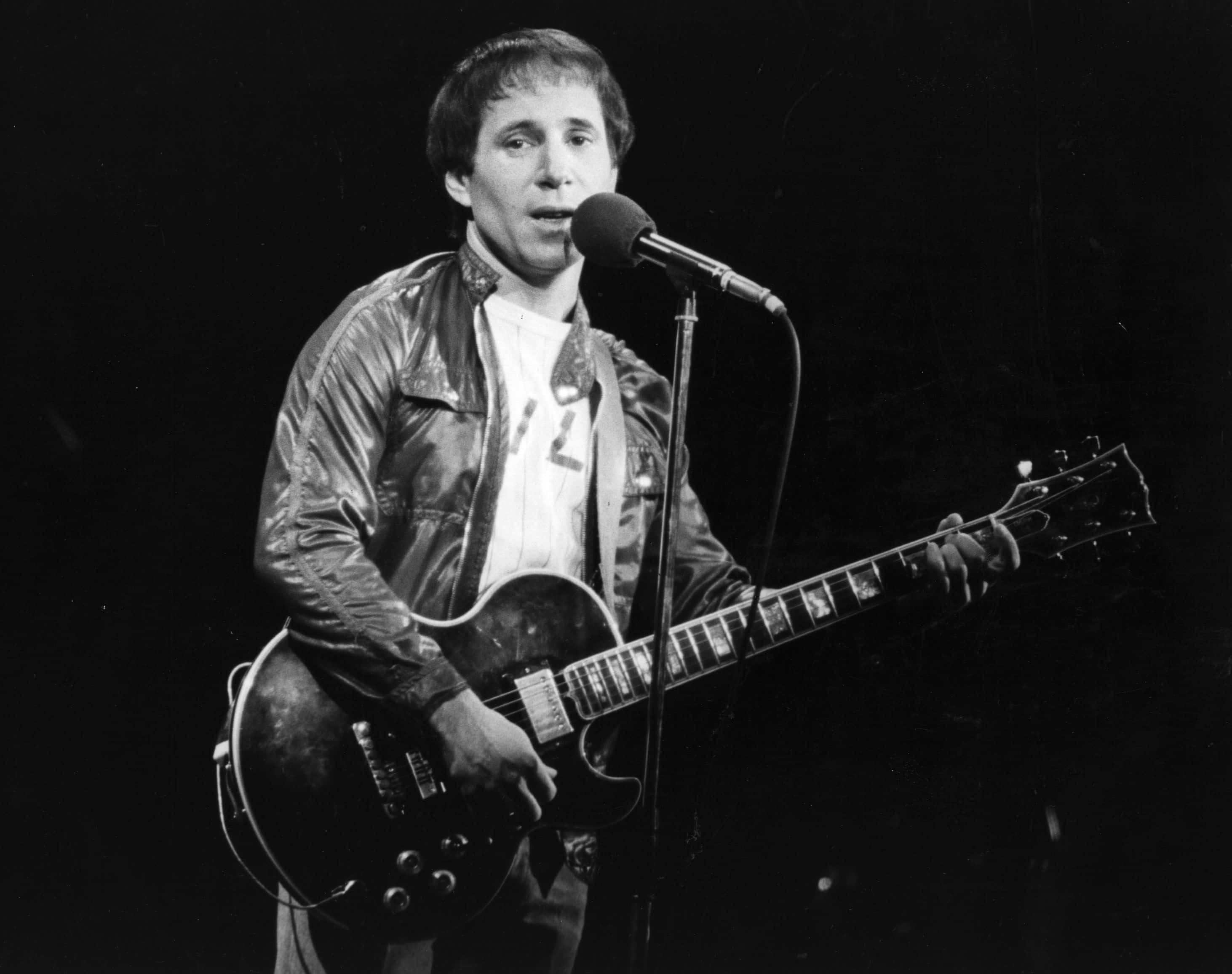 American pop singer and songwriter Paul Simon performing in London
