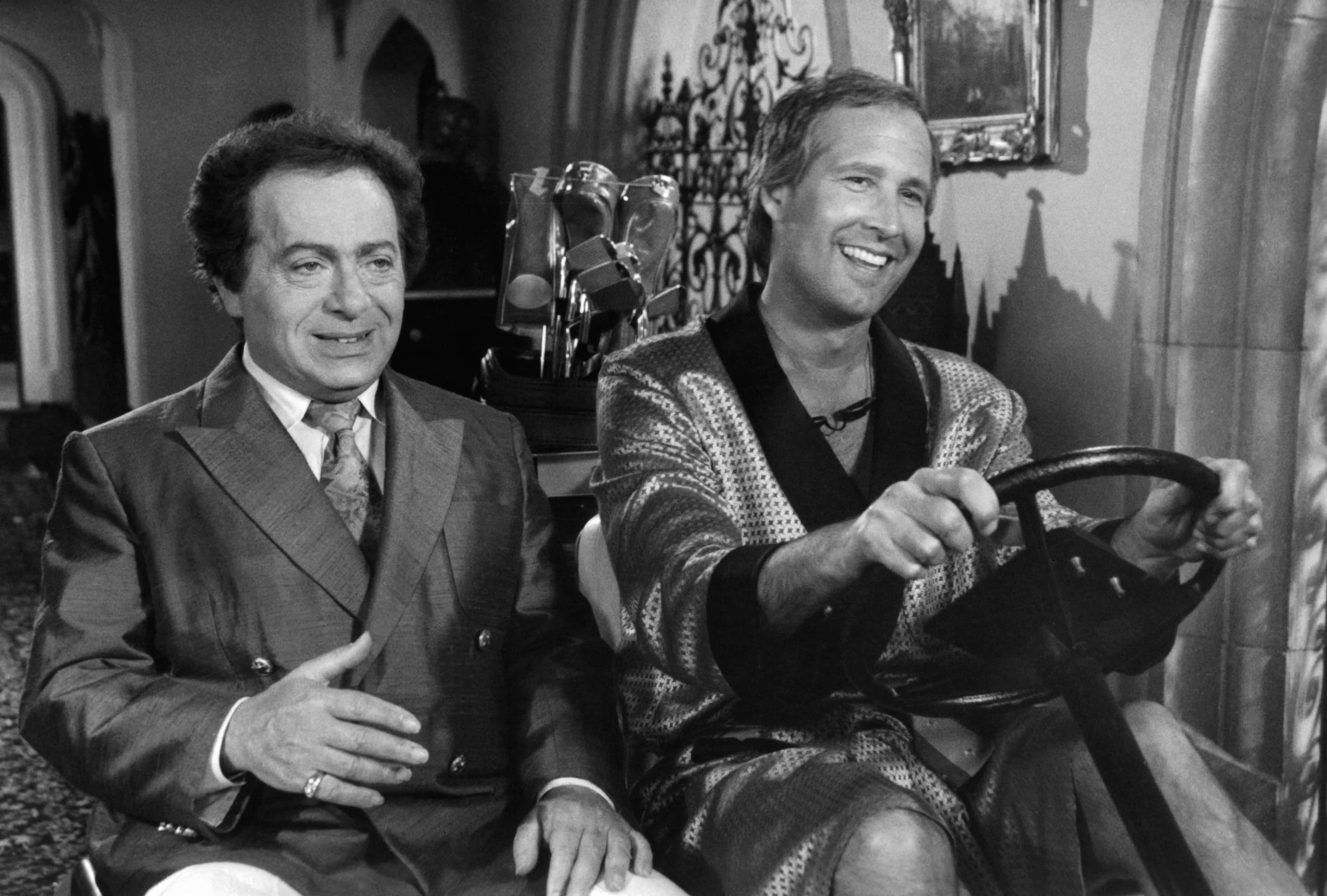 Actor Jackie Mason and Chevy Chase on set of the movie " Caddyshack II " , circa 1988. 