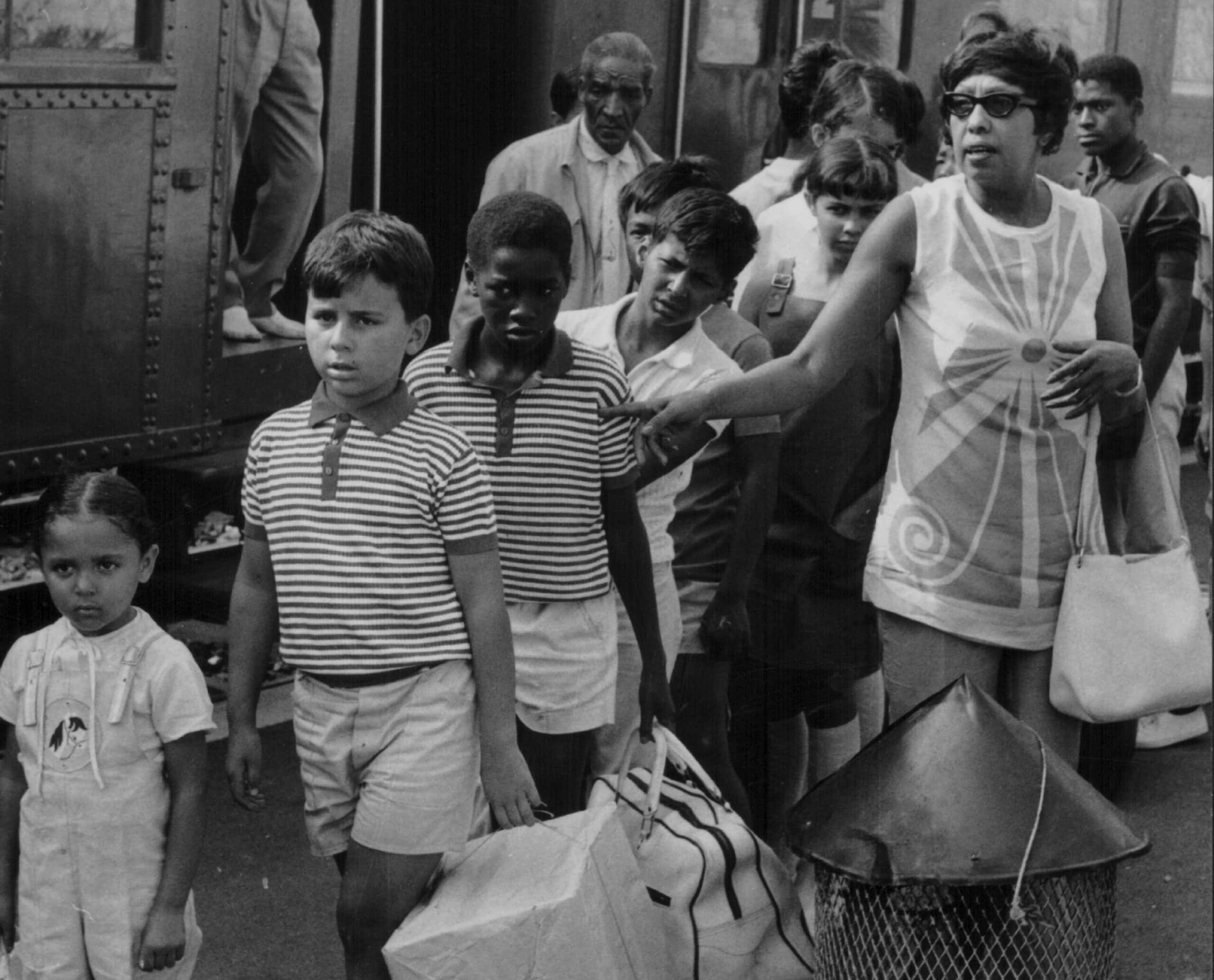 Dancer Josephine Baker and her 12 adopted children arriving at Monaco train station