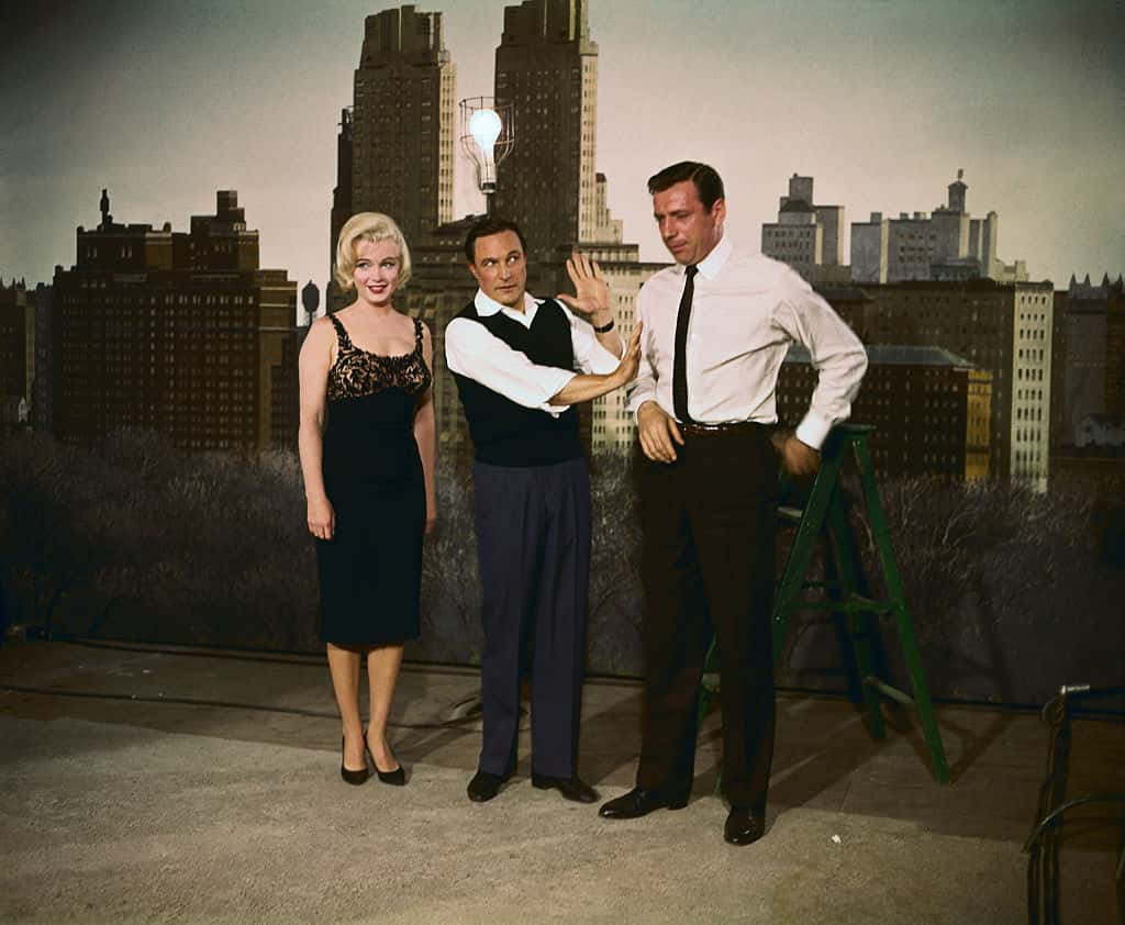 Marilyn Monroe, Gene Kelly, and Yves Montand.