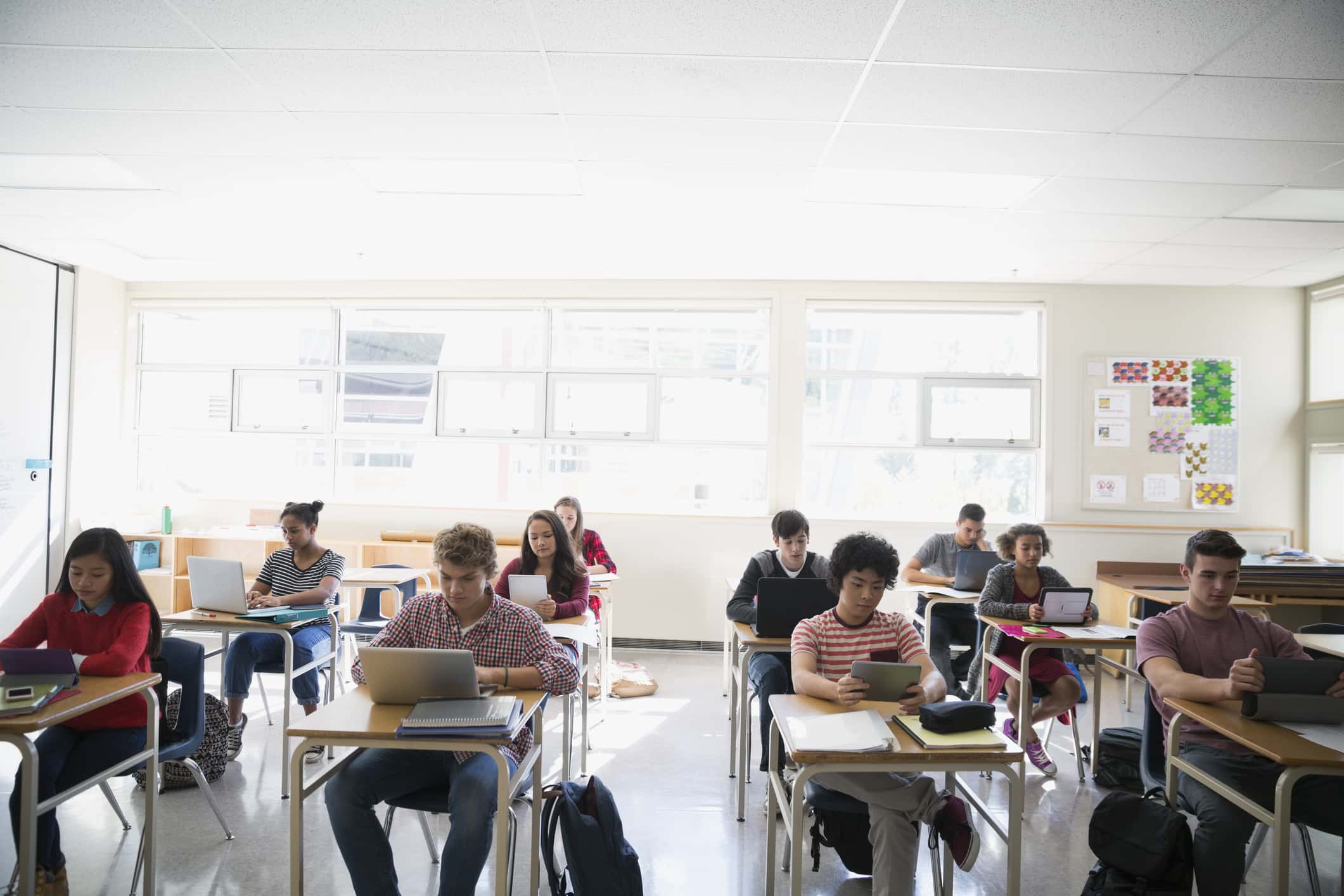 High school students learning digital.