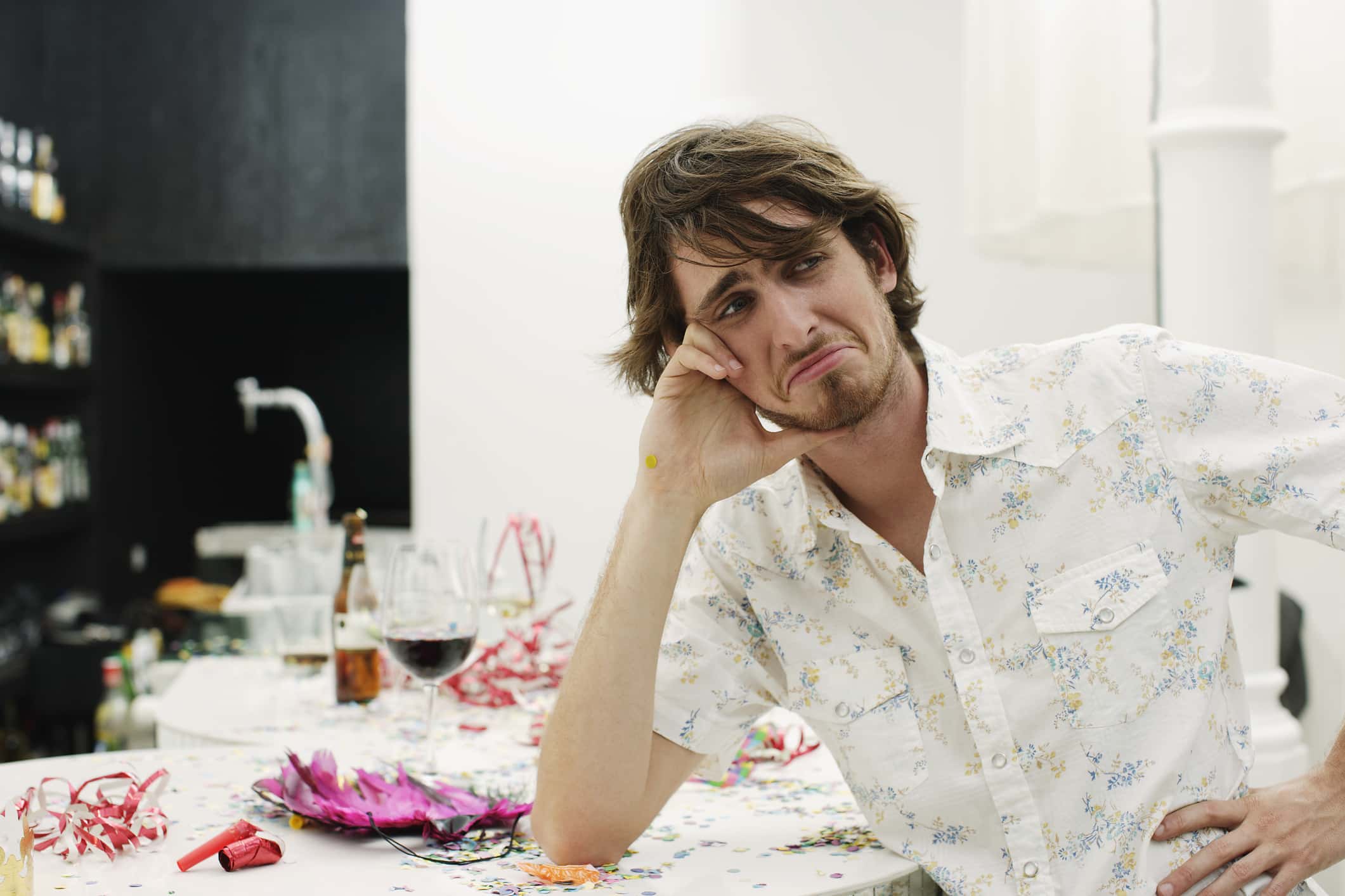 Young man looking at something with sadness.