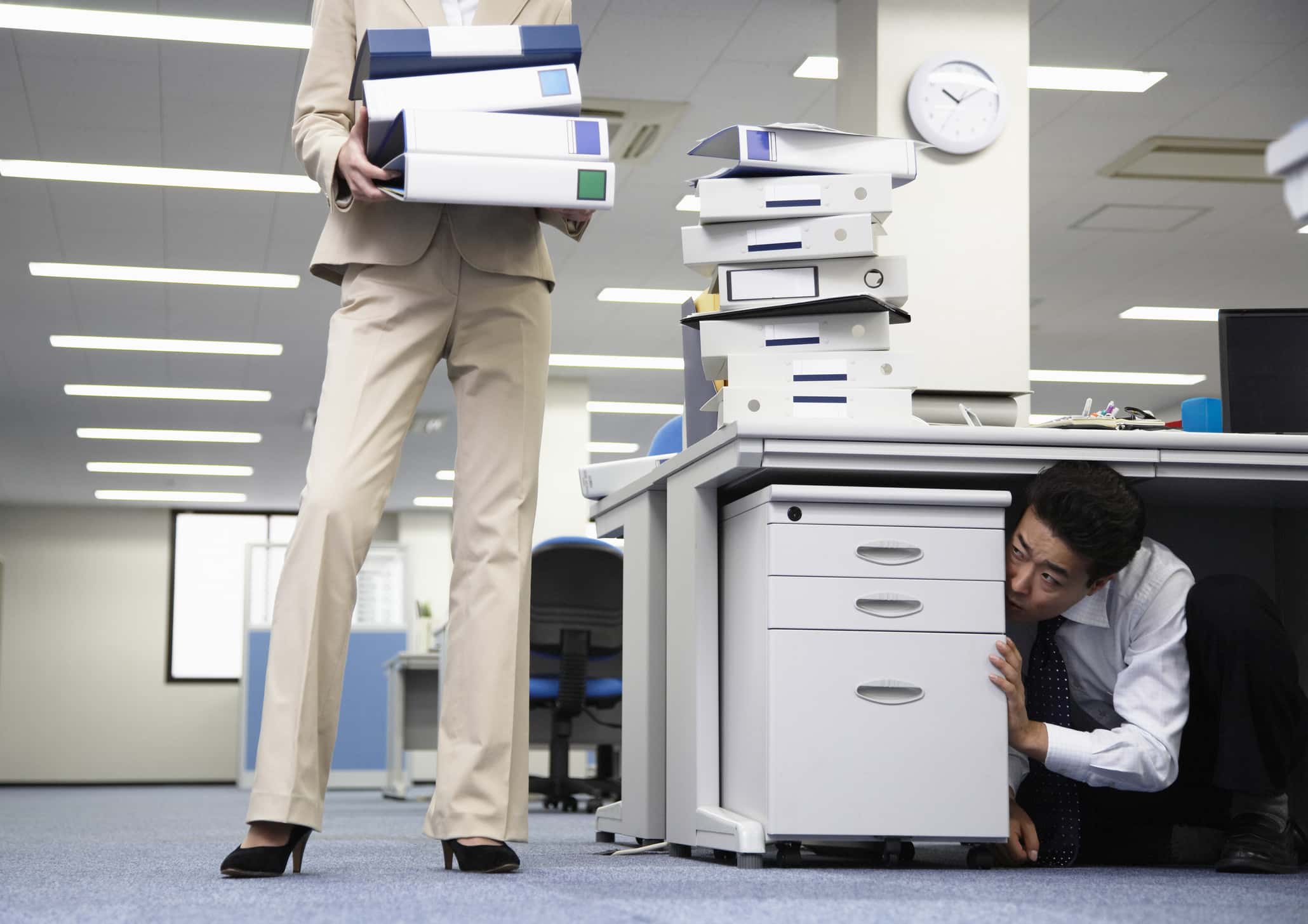 Businessman Hiding from Supervisor