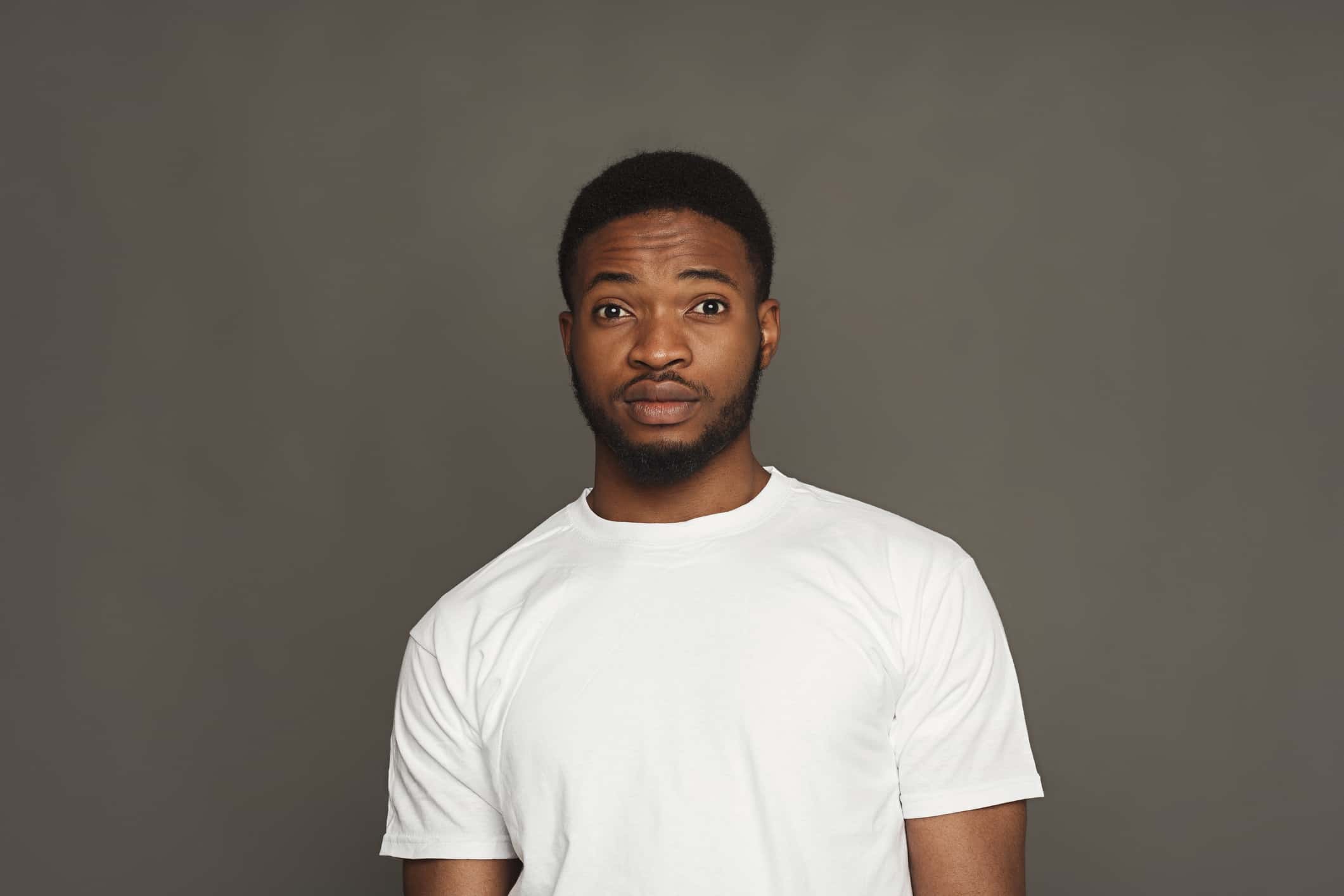 Black man making facial expression.