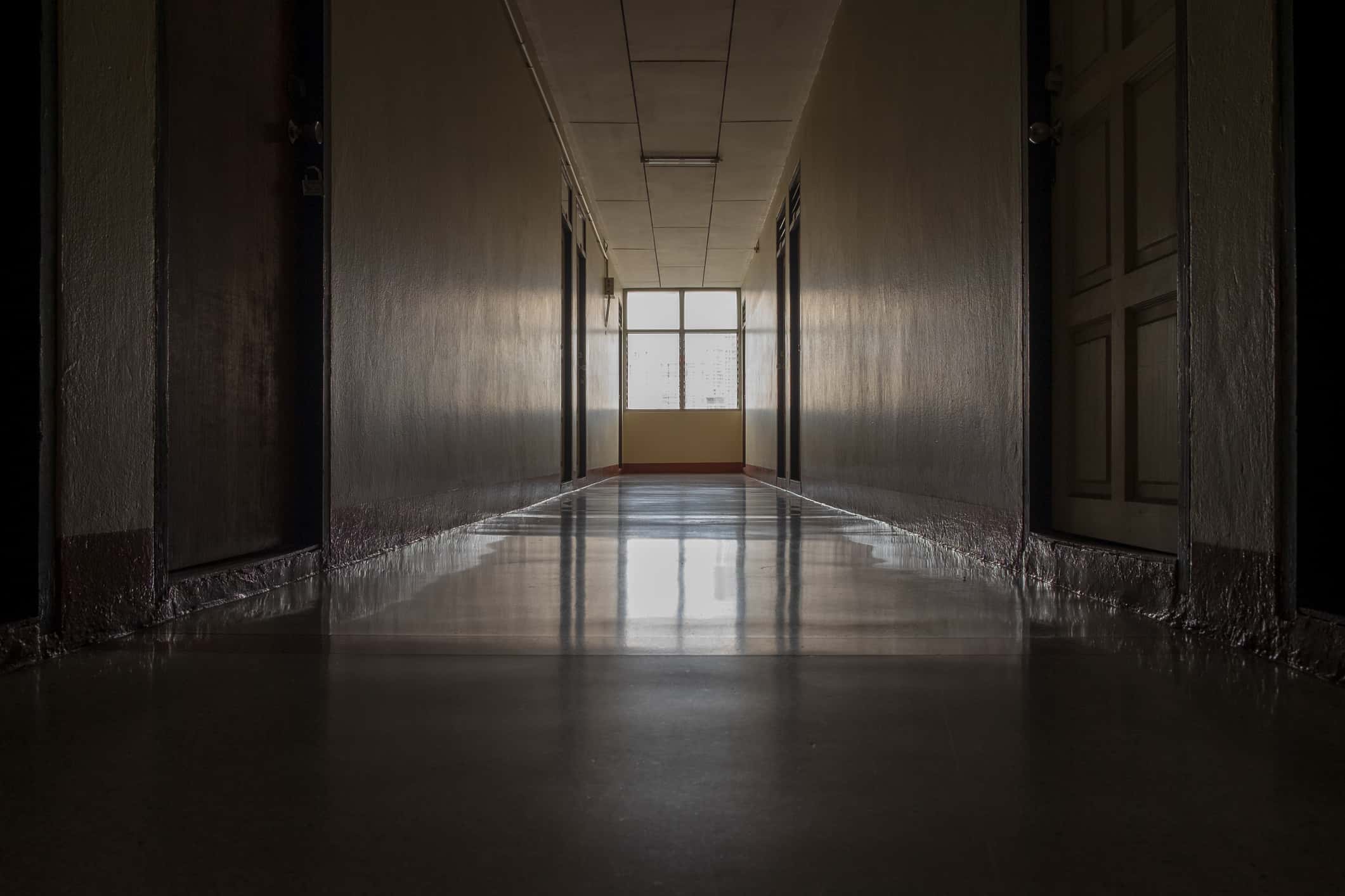 A shot of an empty passage in a dorm.