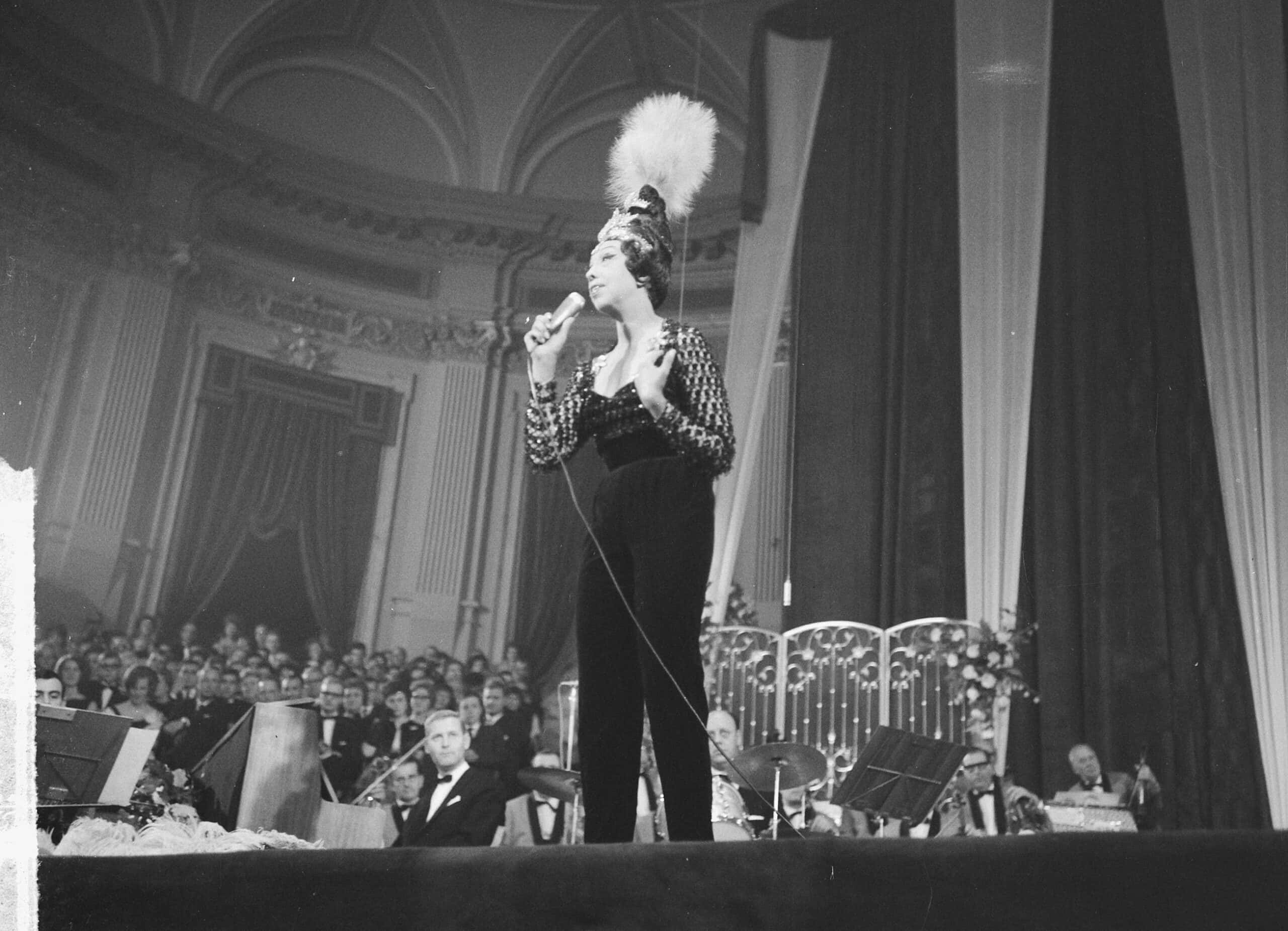 Josephine Baker performing gala in black suit