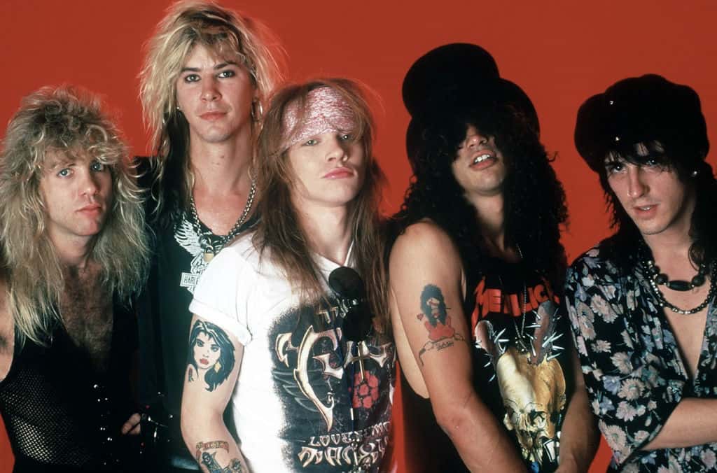 Music group Guns N' Roses pose for a portrait on May 7, 1988, at the Detroit State Theater in Detroit, Michigan.