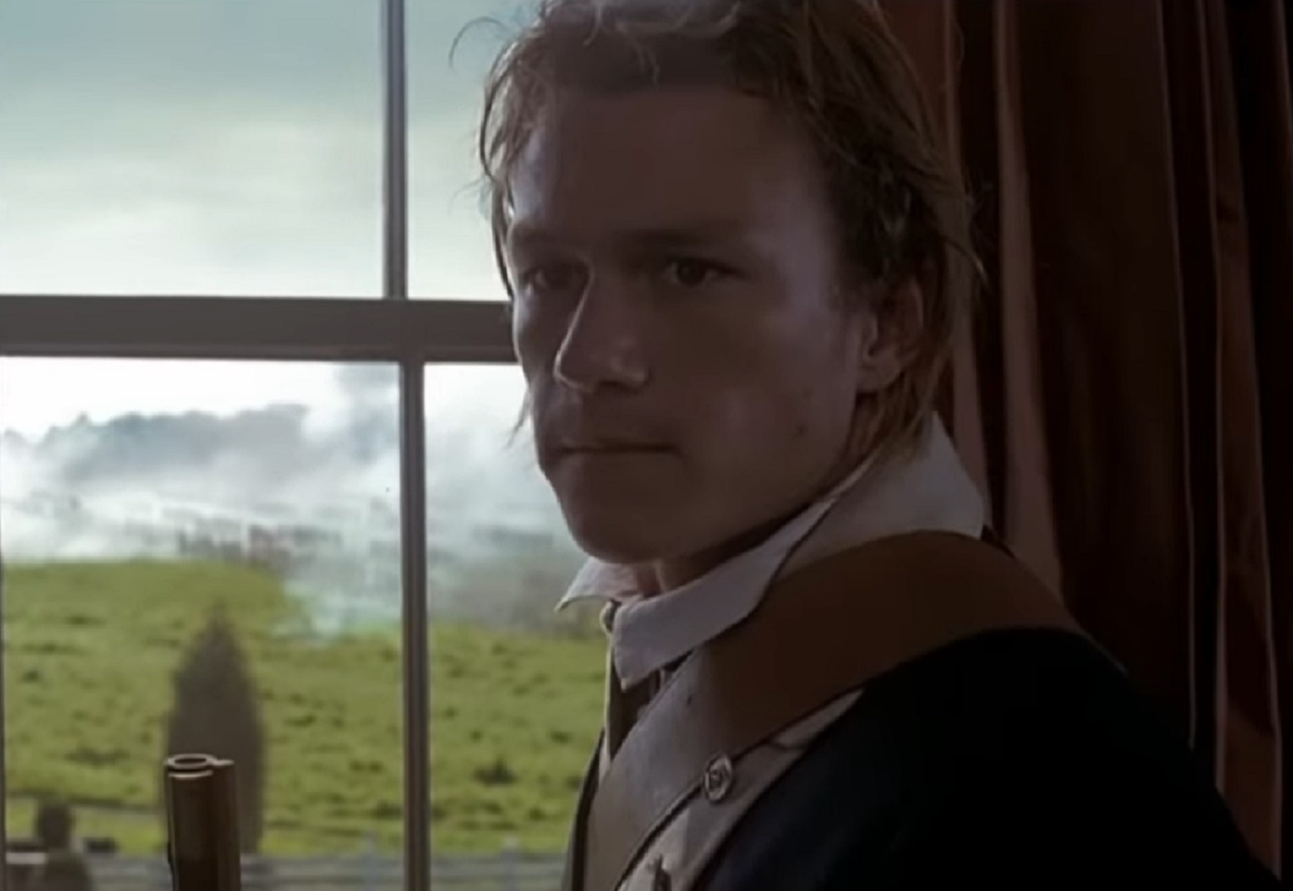 Screenshot: Heath Ledger close up face shot looking upset