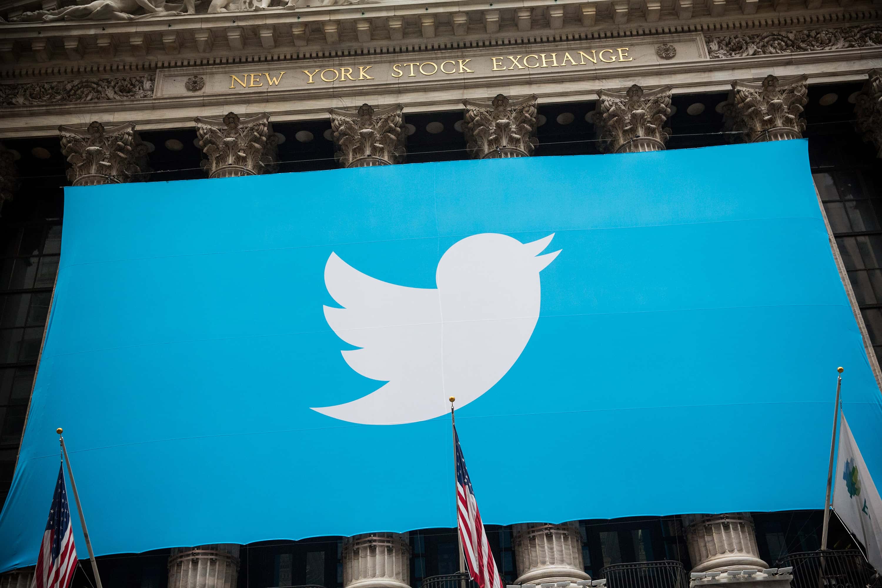 The Twitter logo is displayed on a banner outside the New York Stock Exchange