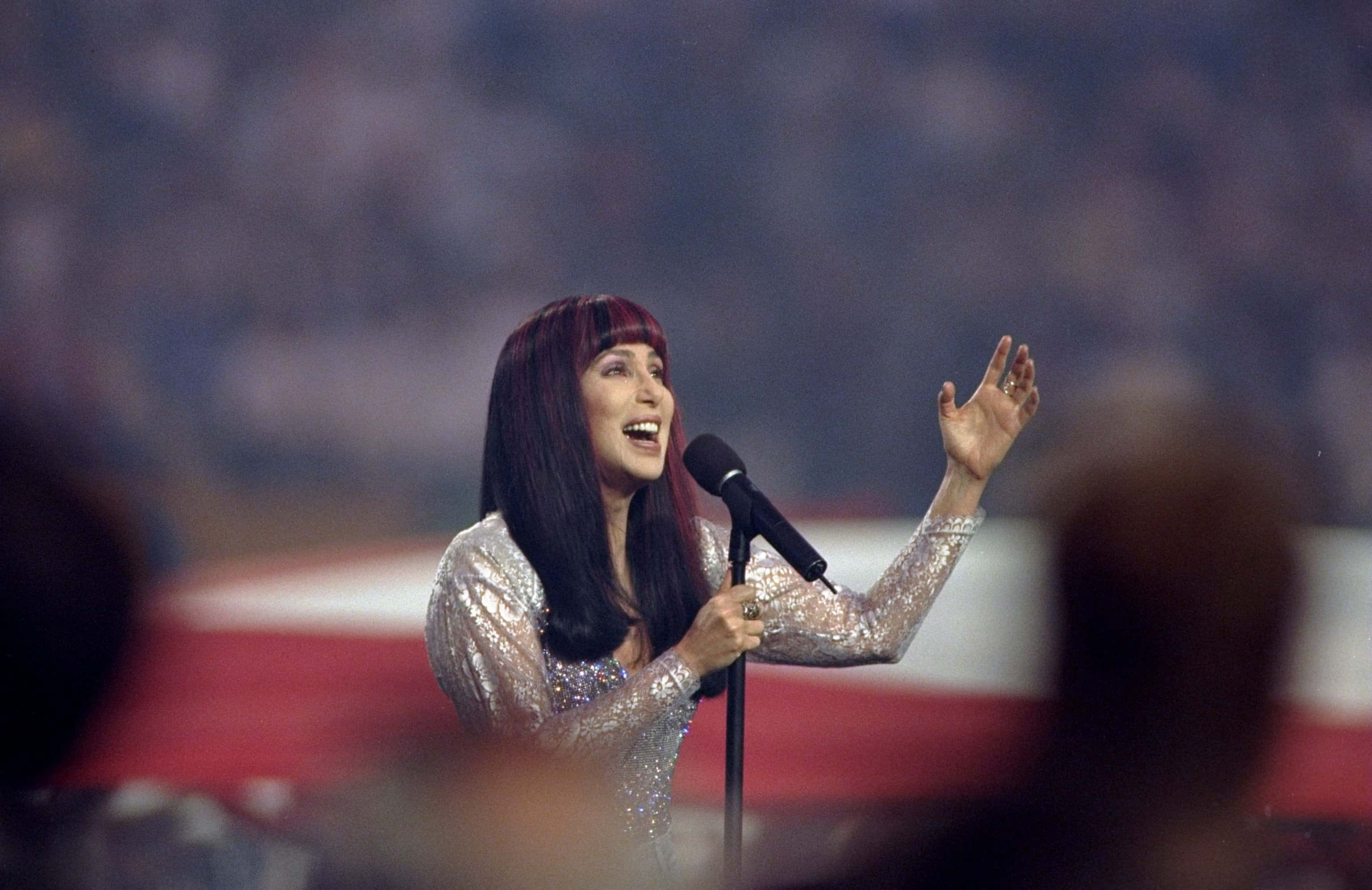 Cher sings the National Anthem during the pre-game show for Super Bowl
