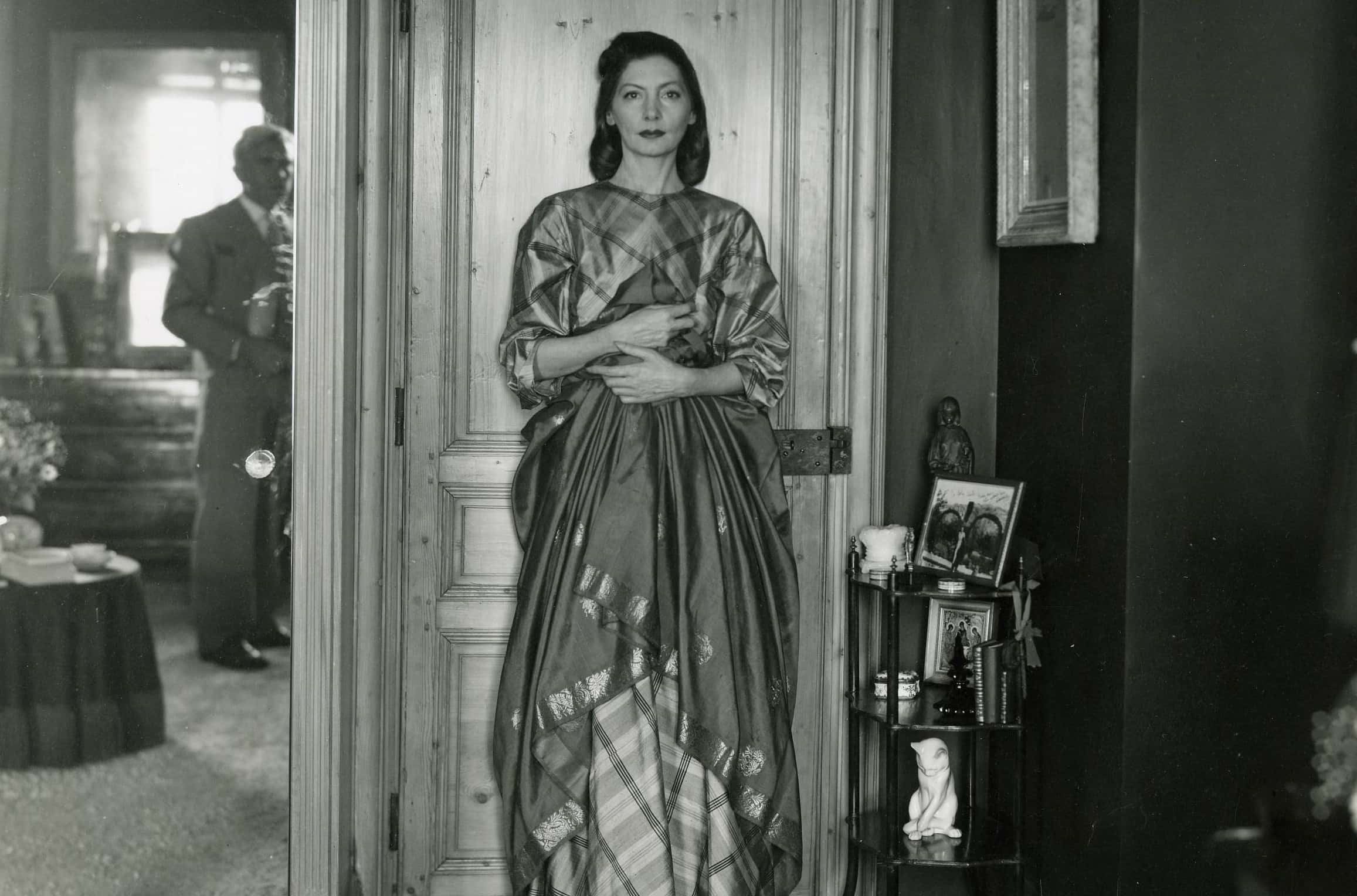 Mrs. George Schlee. She is wearing a mauve plaid gown of Indian fabric