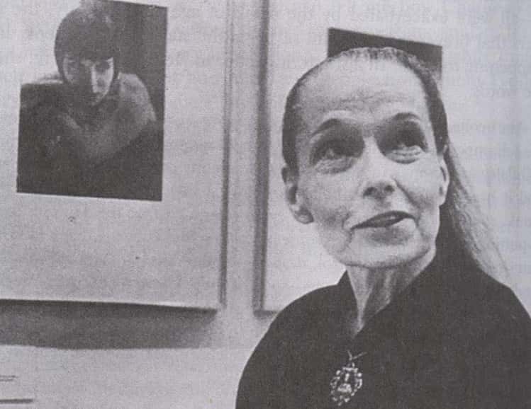 Grayscale Portrait Photo of the actress Louise Brooks in her Later Life, wearing black dress, smiling
