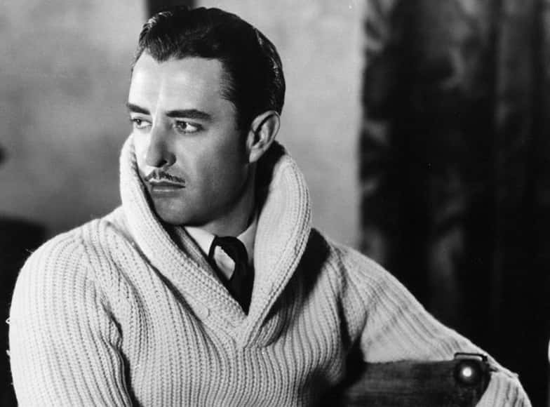 John Gilbert in sweater looking left
