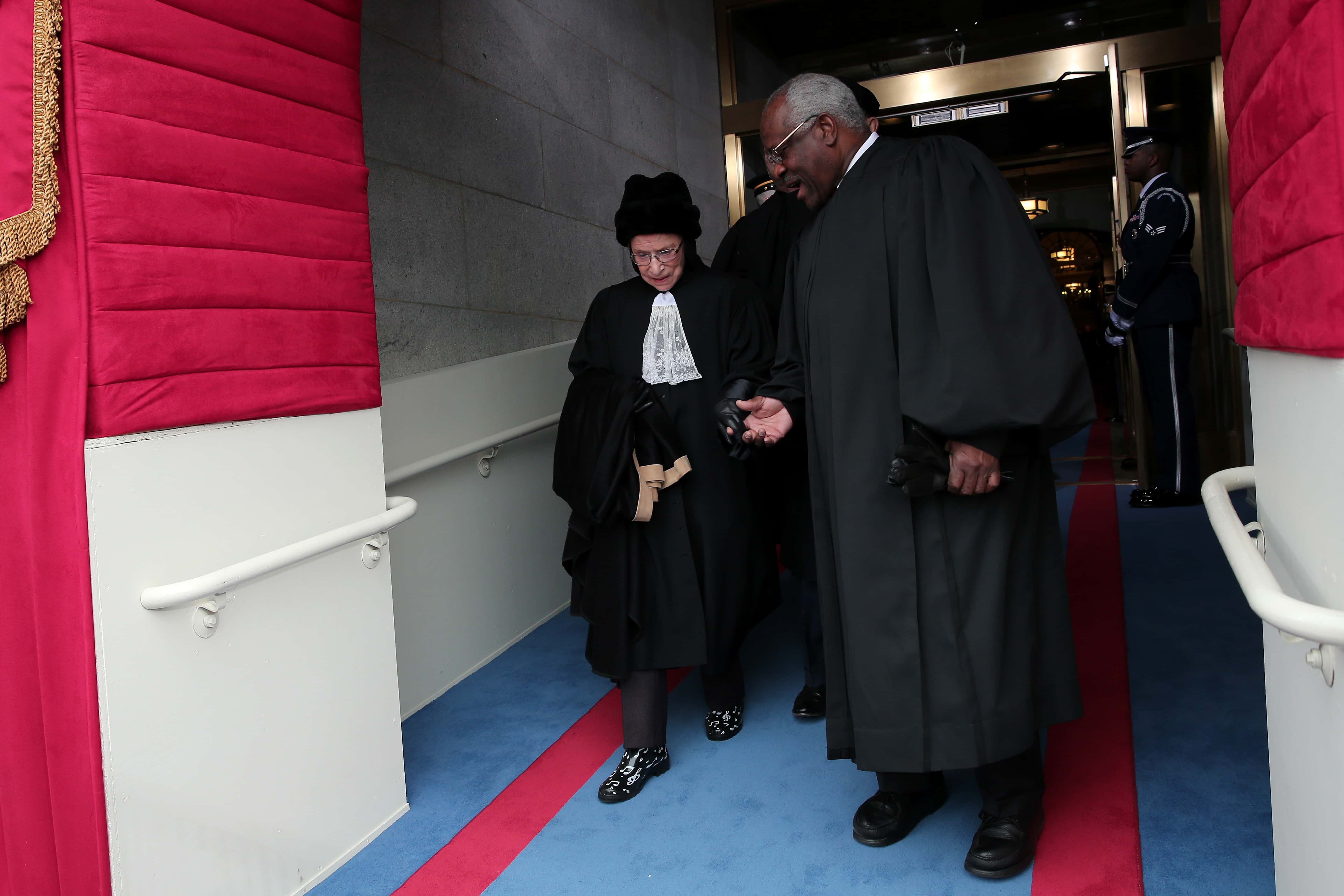 Justice Ruth Bader Ginsburg and Justice Clarence Thomas arrive during the presidential inauguration