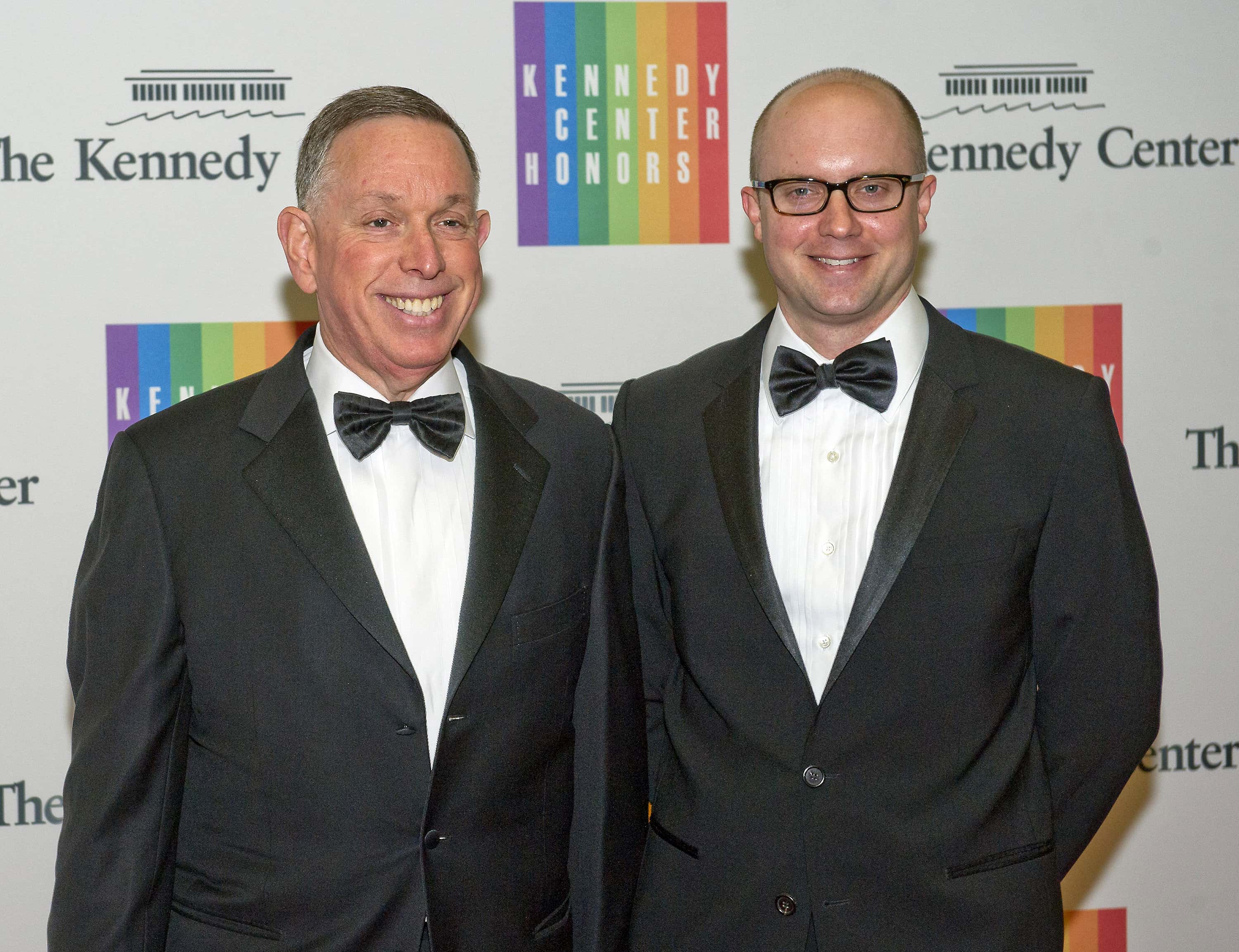 Michael Kaiser and John Roberts arrive for the formal Artist's Dinner honoring the recipients of the 2013 Kennedy Center Honors in tuxedos looking at the camera