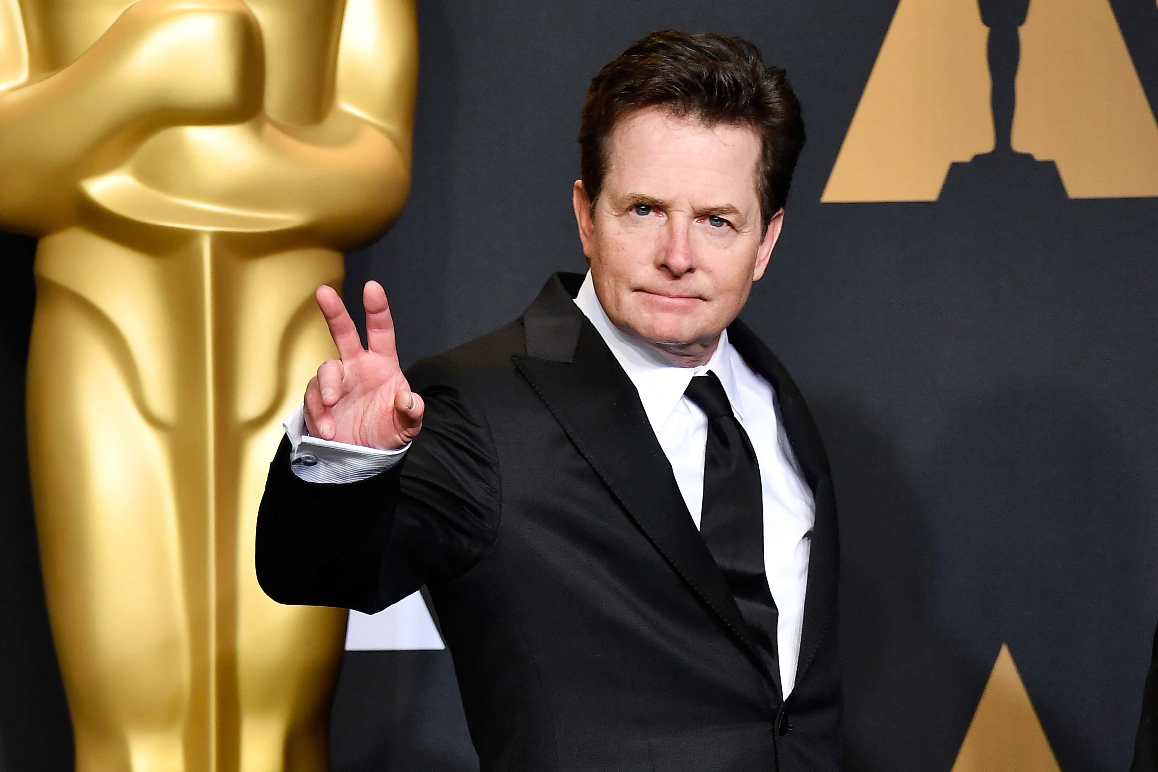 Actor Michael J. Fox poses in the press room