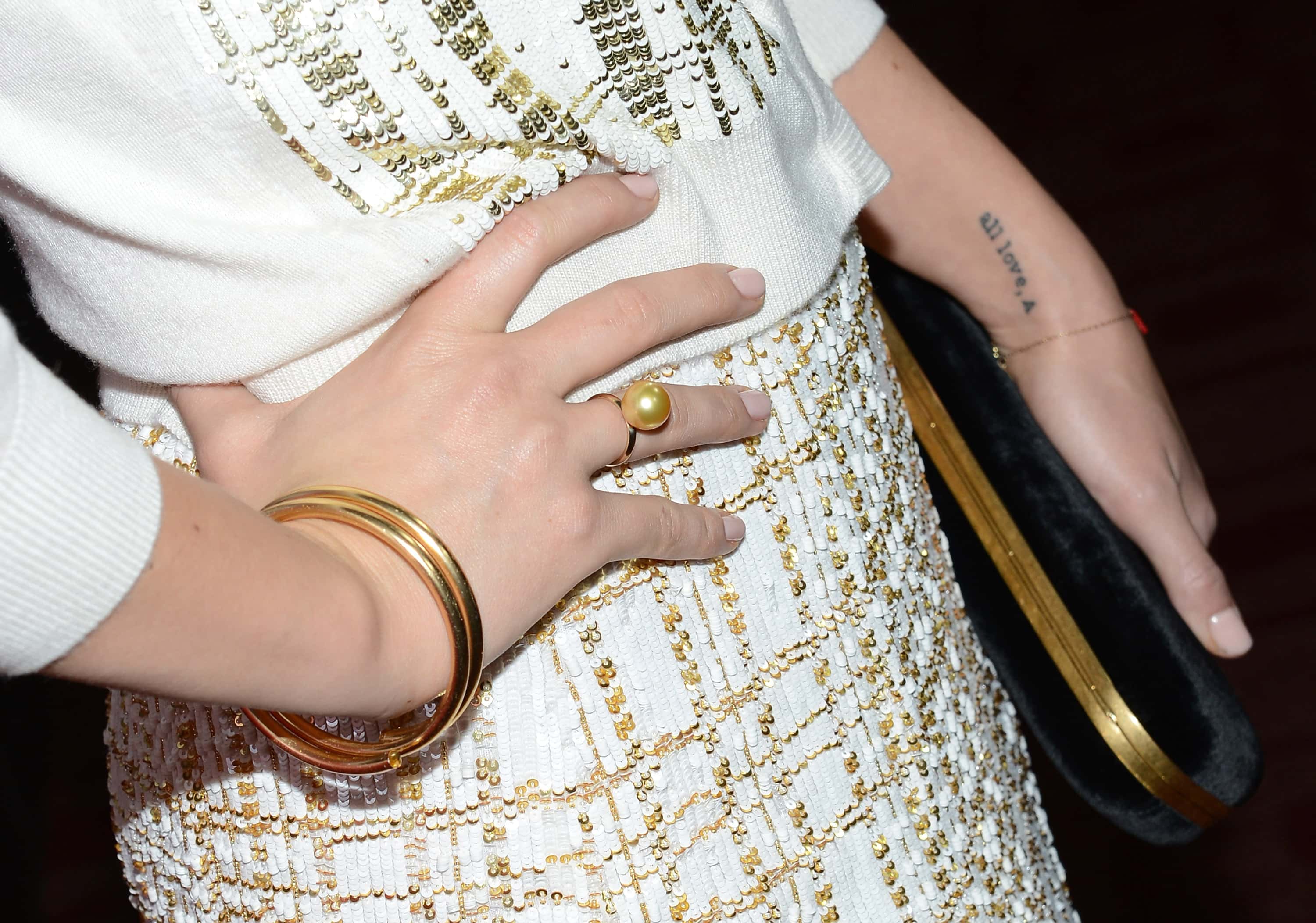 Actress Olivia Wilde (accessories detail) and tattoo