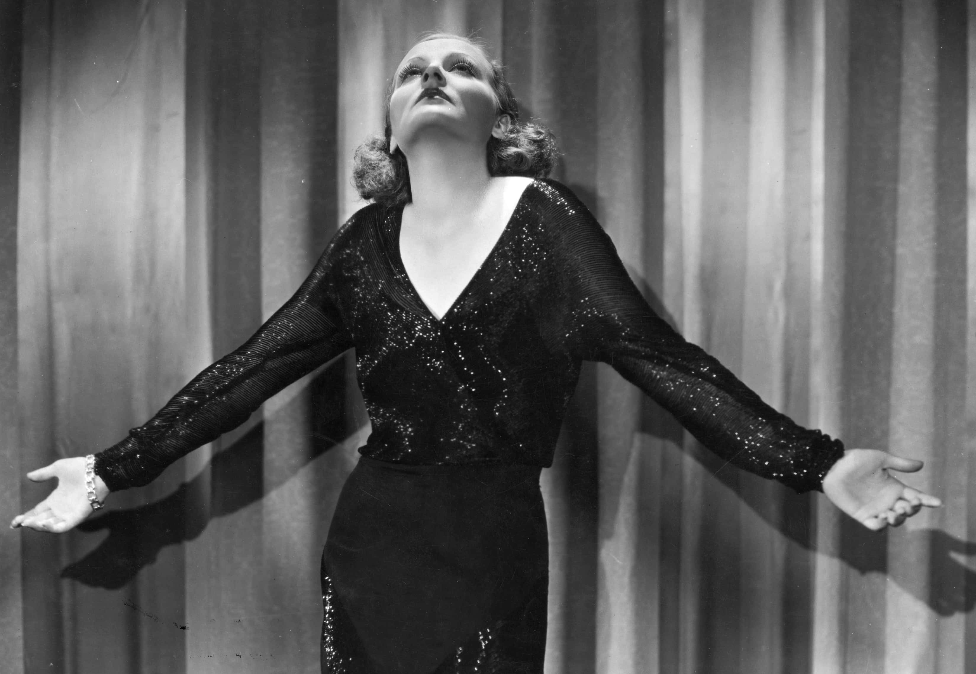 Tallulah Bankhead in black shiny dress