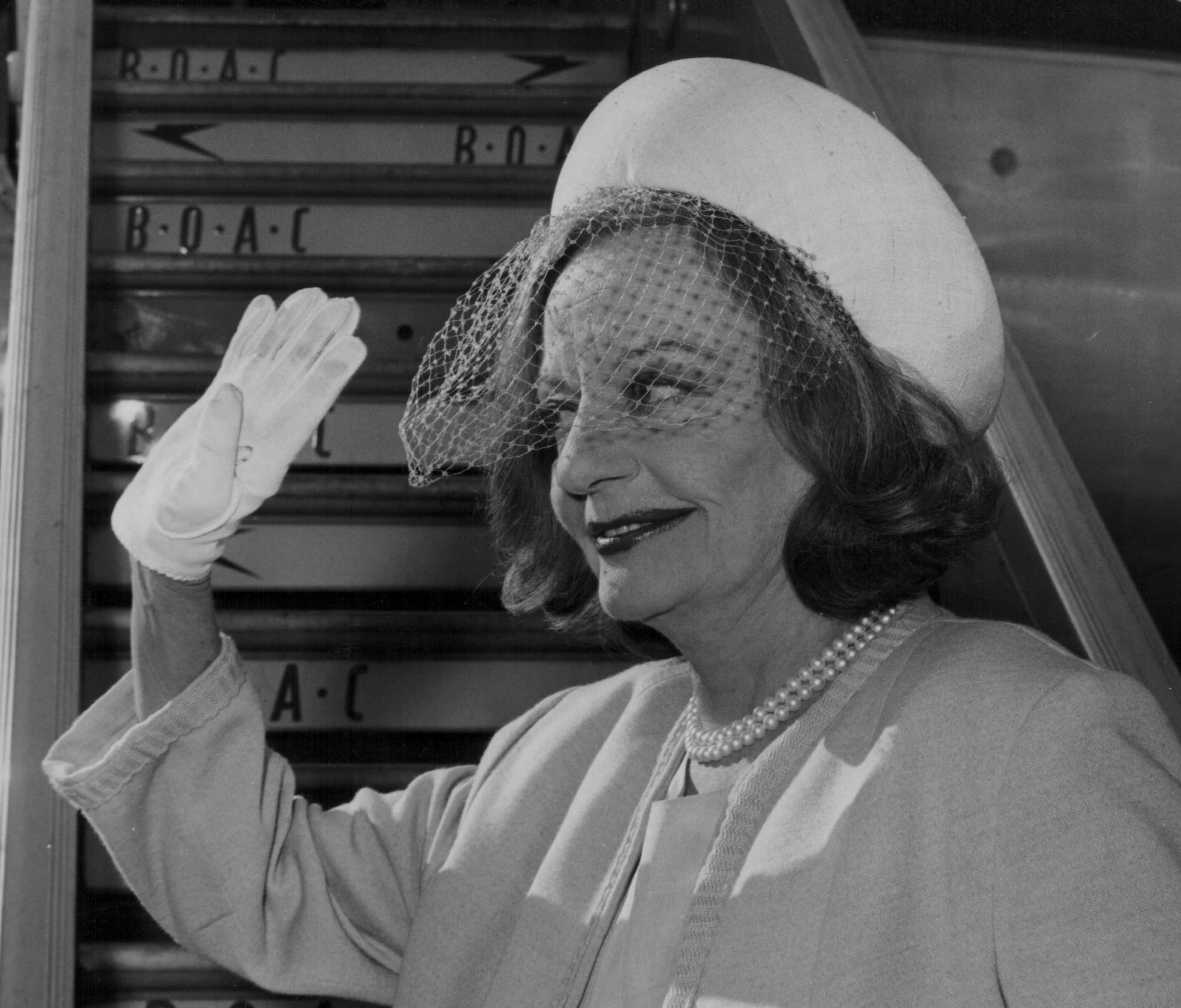 Tallulah Bankhead at airport waving