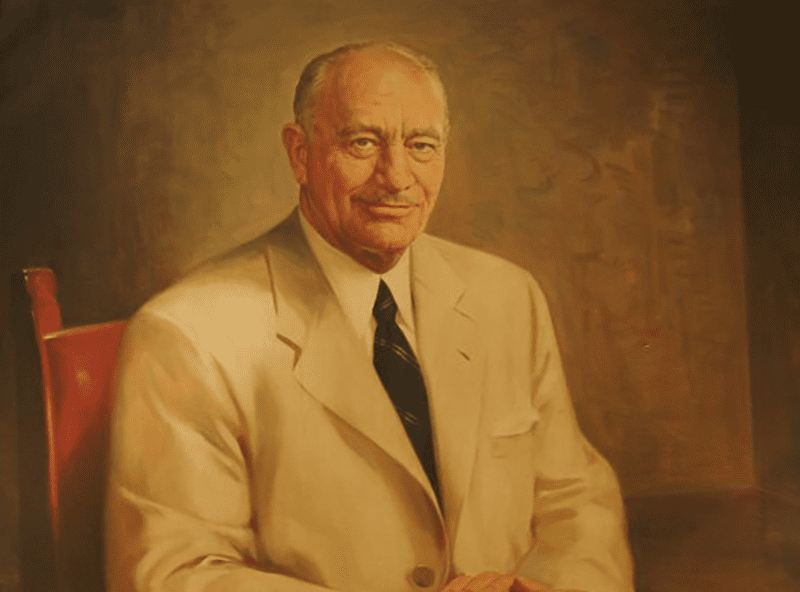 conrad hilton portrait in white suit