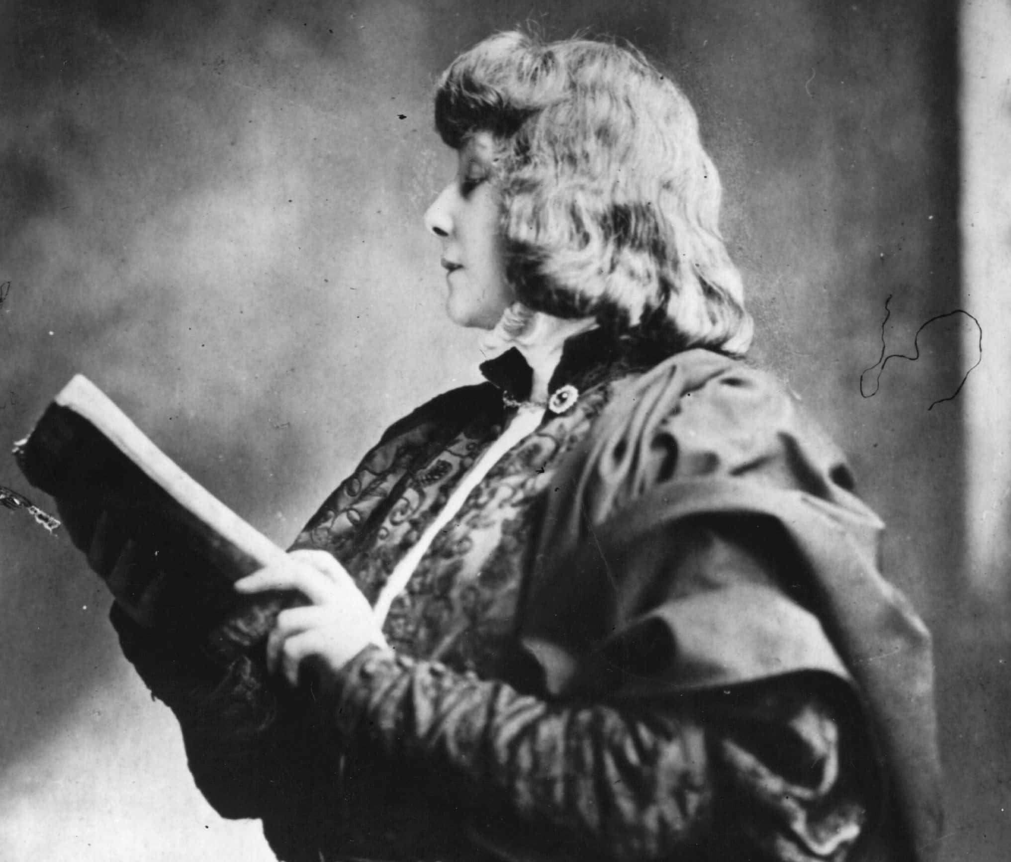 Sarah Bernhardt  reading a book 
