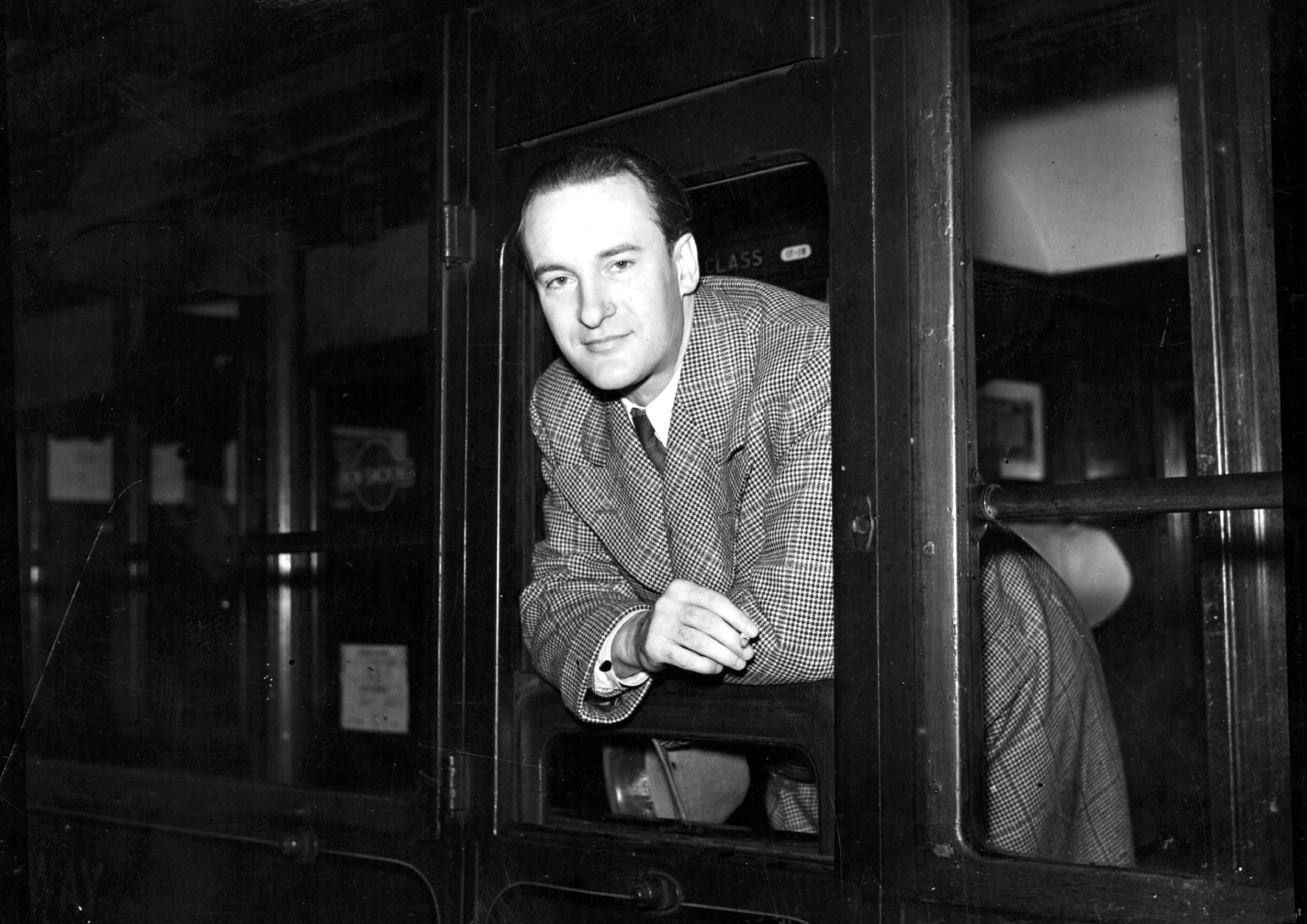 George Sanders in plaid suit