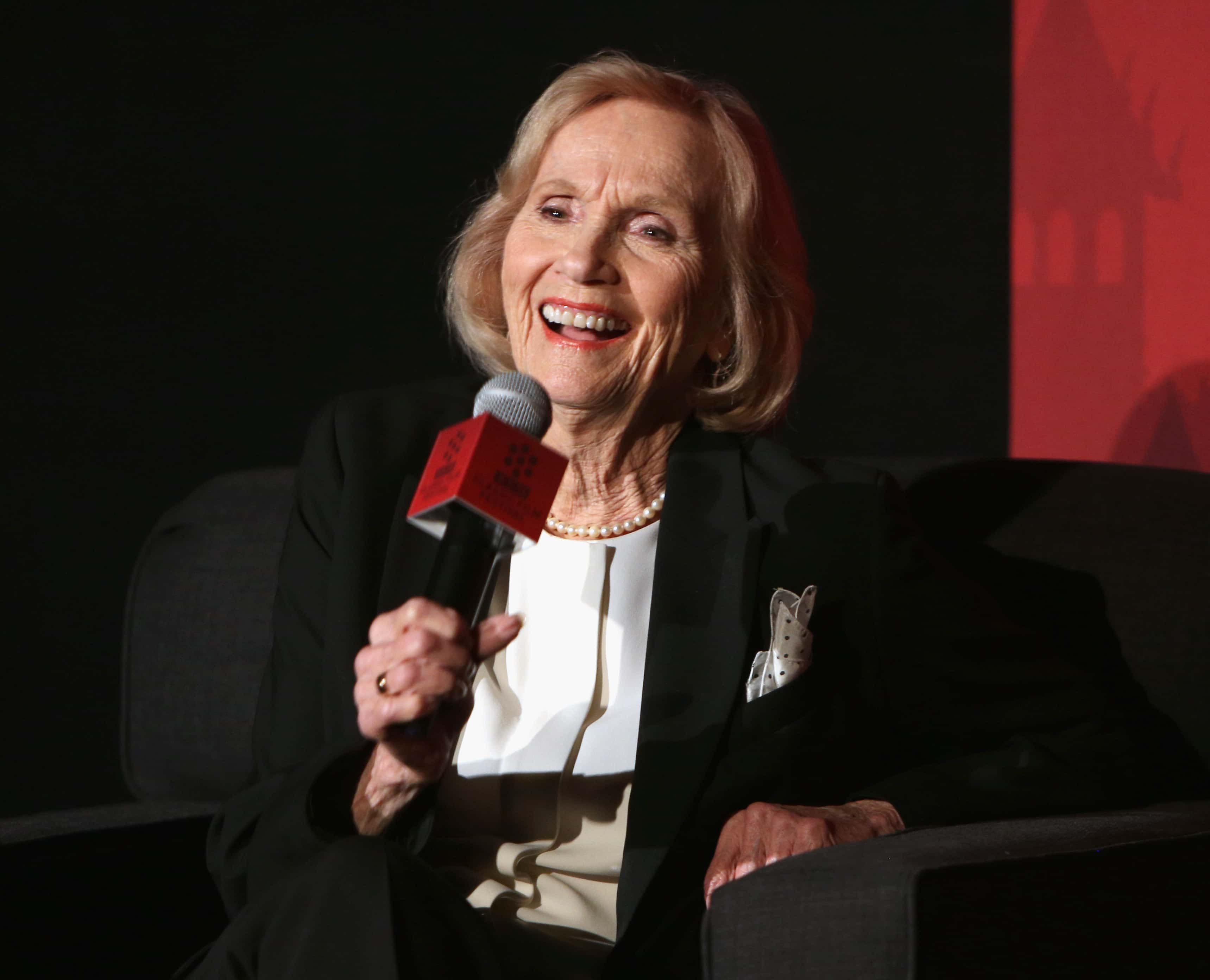 Eva Marie Saint in black suit speaking at event