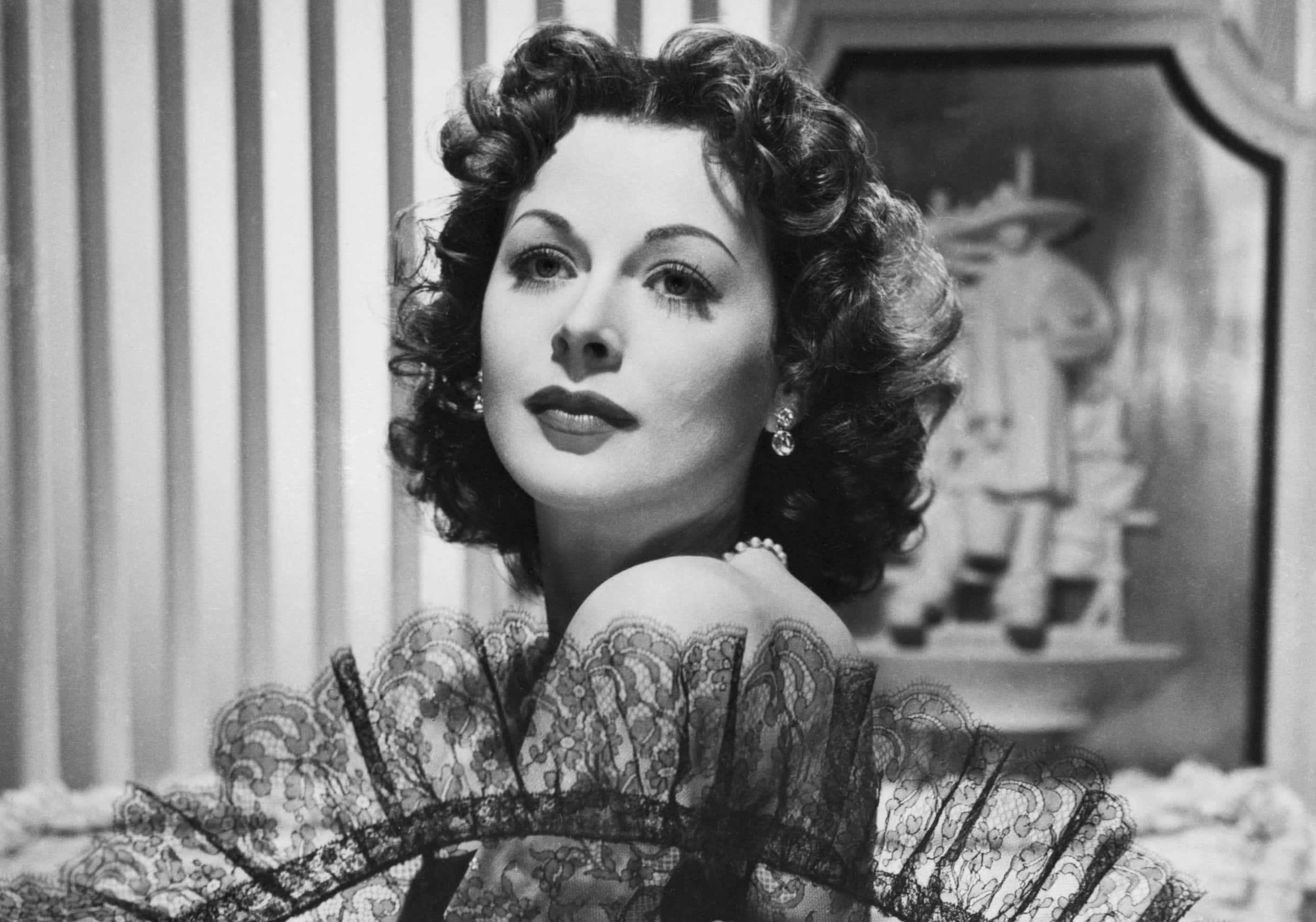 Hedy Lamarr and an elegant ribbon-trimmed black lace fan - 1950