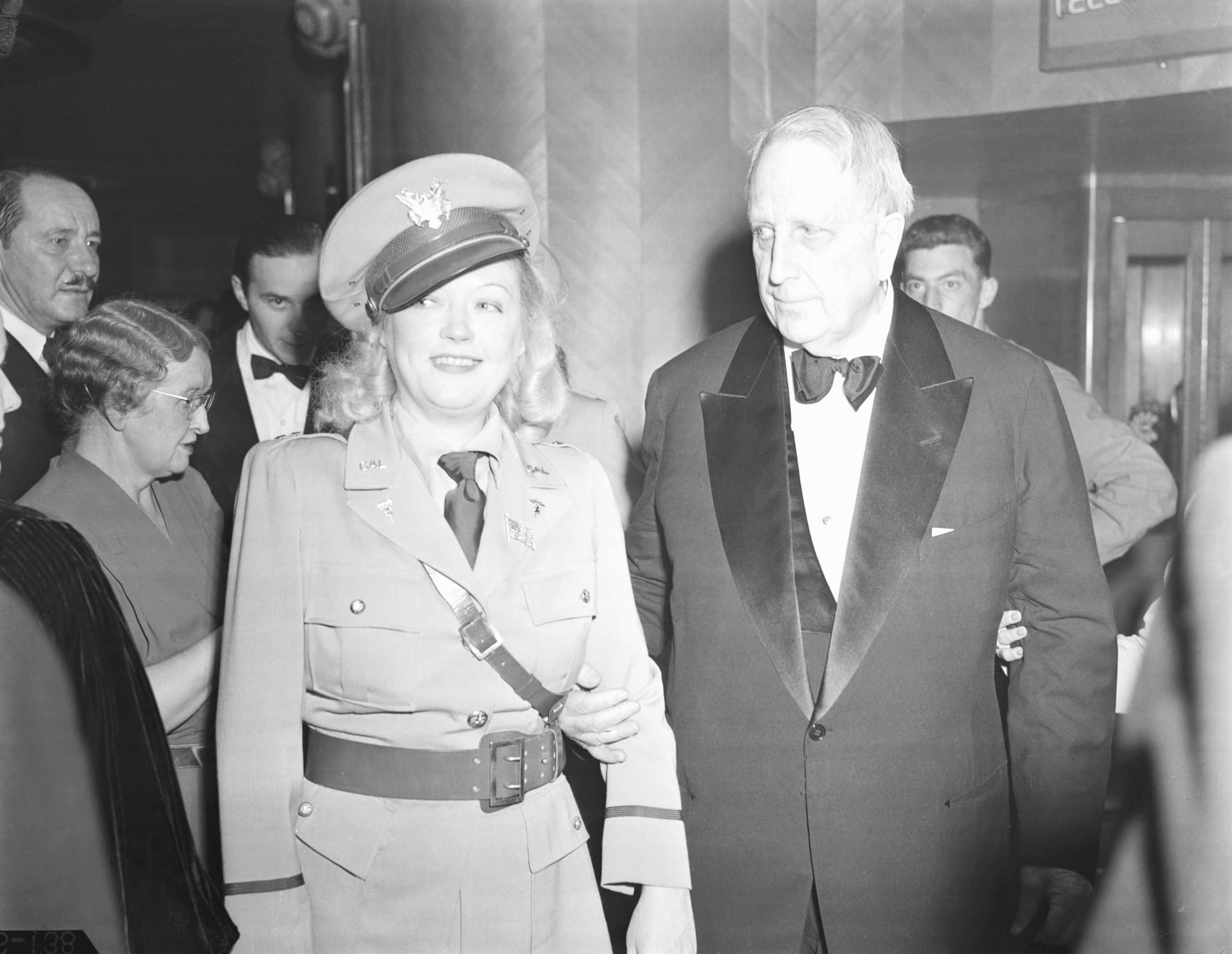William Randolph Hearst with Marion Davies are shown leaving the California State guard Military Ball held at the Palladium, Hollywood