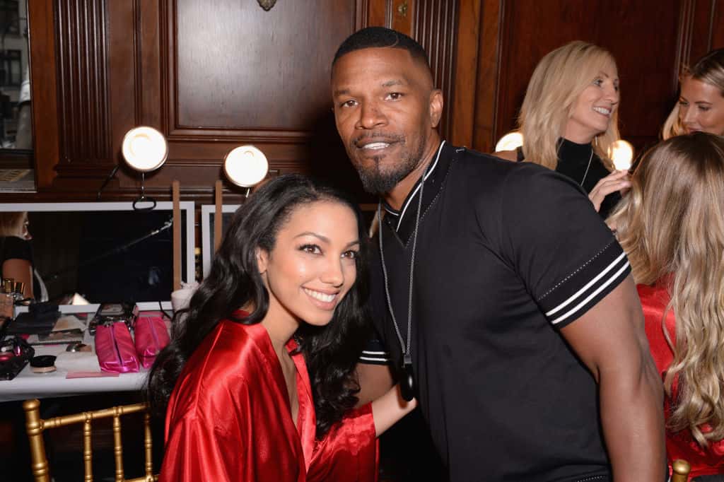 Corinne Foxx and Jamie Foxx pose backstage