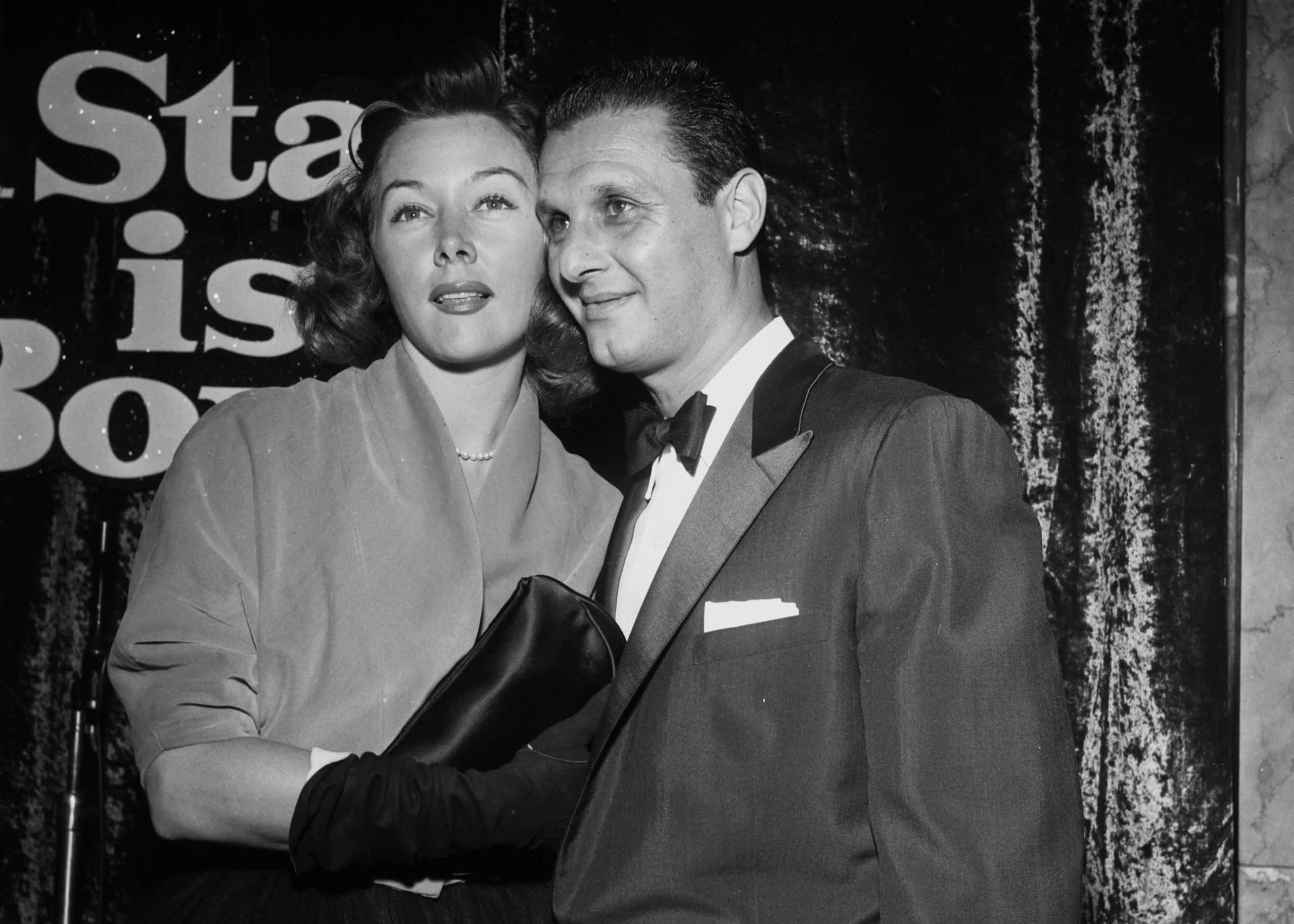 Actress Gloria Grahame with Cy Howard at an event 