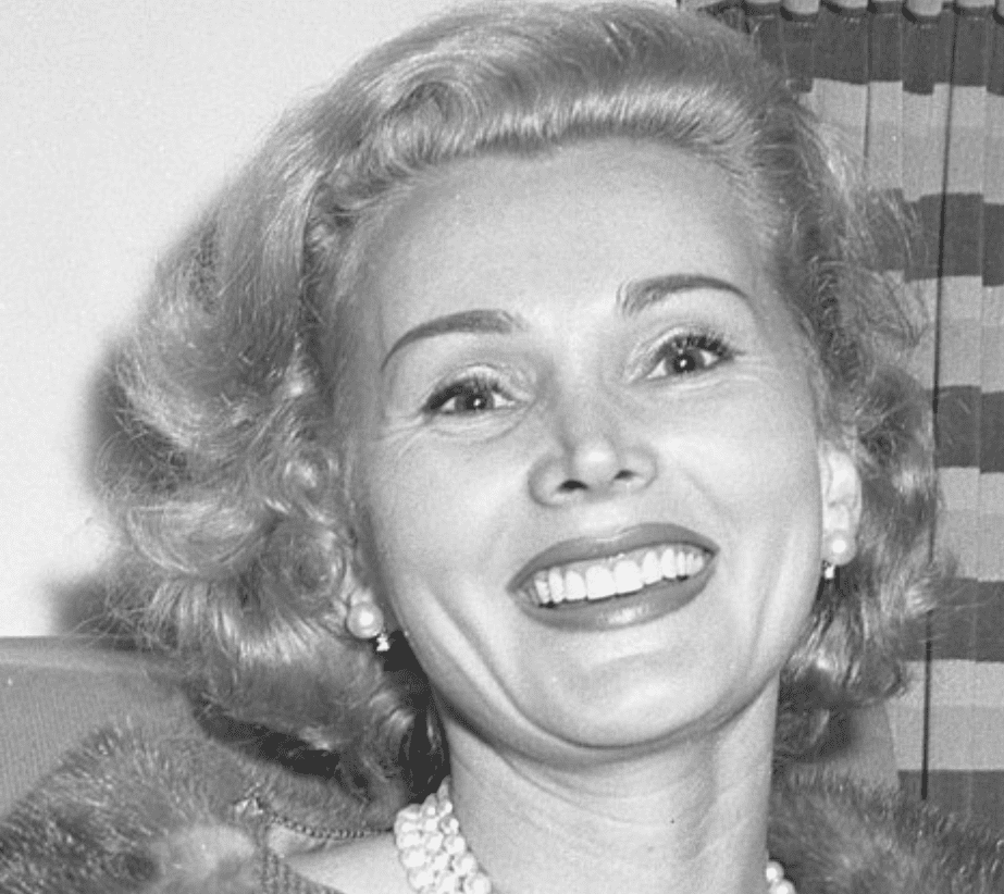 Portrait picture of Zsa Zsa Gabor smiling and wearing pearl neckless