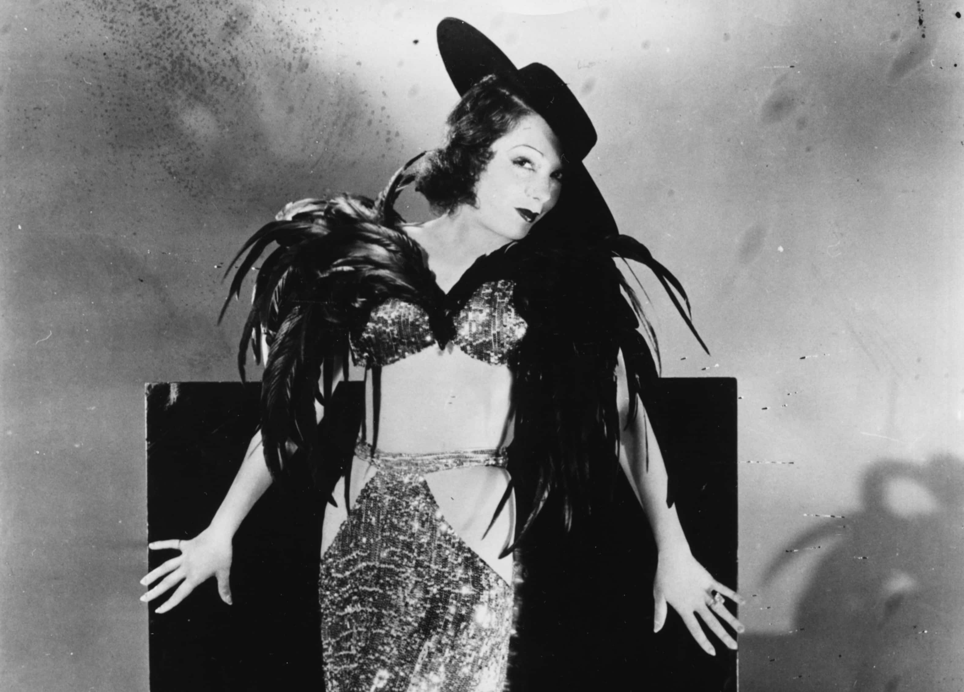 Portrait of Mexican actress Lupe Velez wearing a revealing, feather outfit