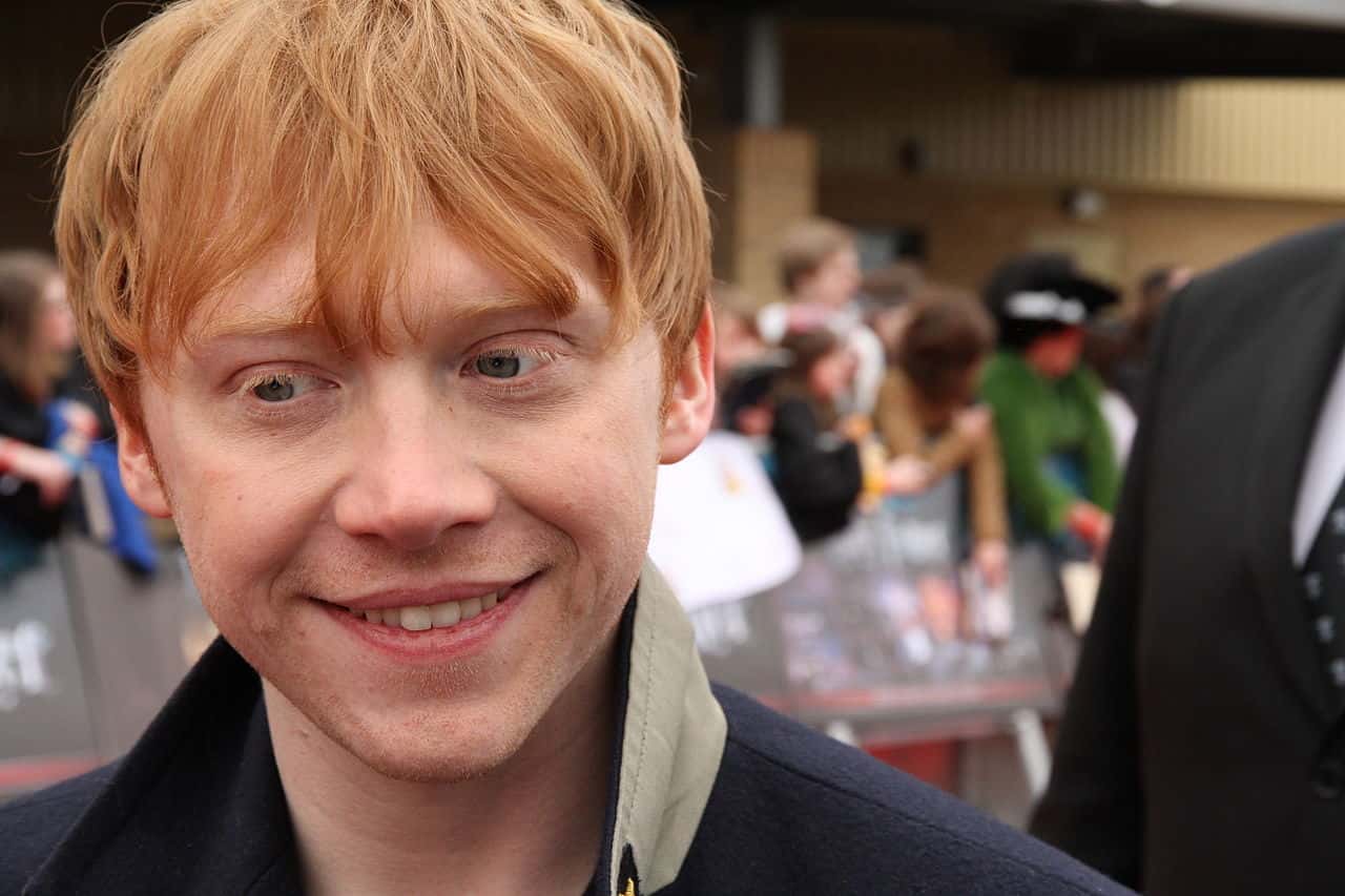 Rupert Grint wearing a black jacket