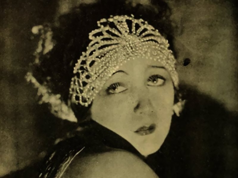 Barbara La Marr wearing hear jewelry
