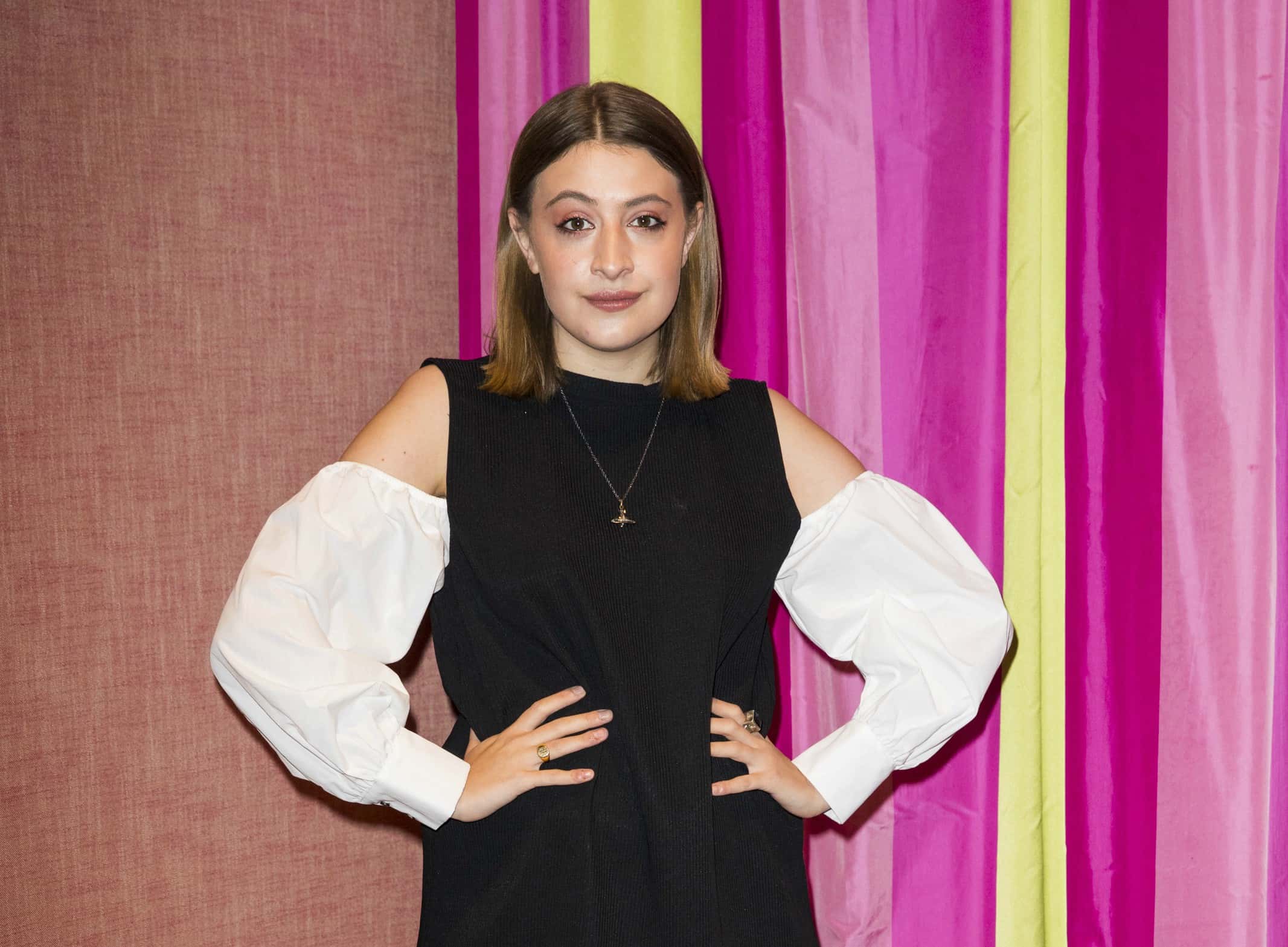 Georgia Groome wearing a black and white dress