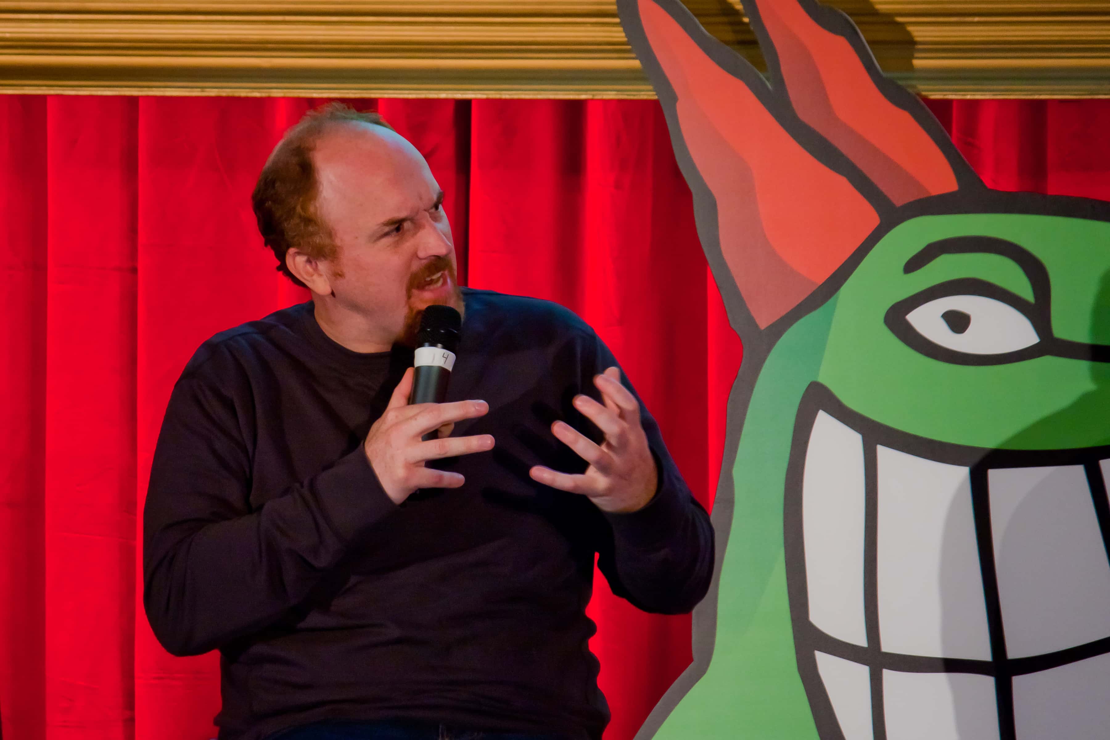 Portrait Photo of Louis CK speaking at Just For Laughs
