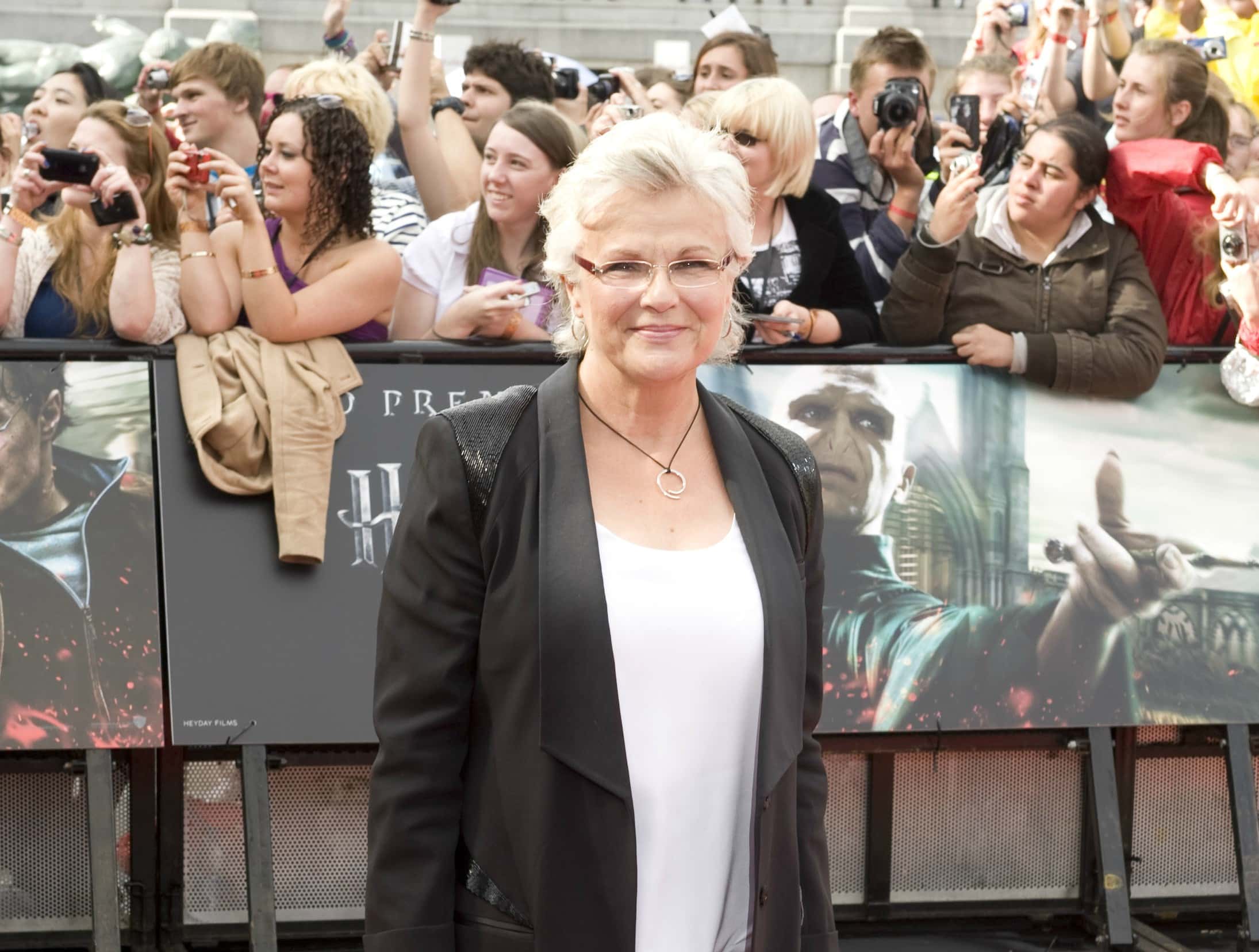 Julie Walters wearing a white shirt and a black jacket
