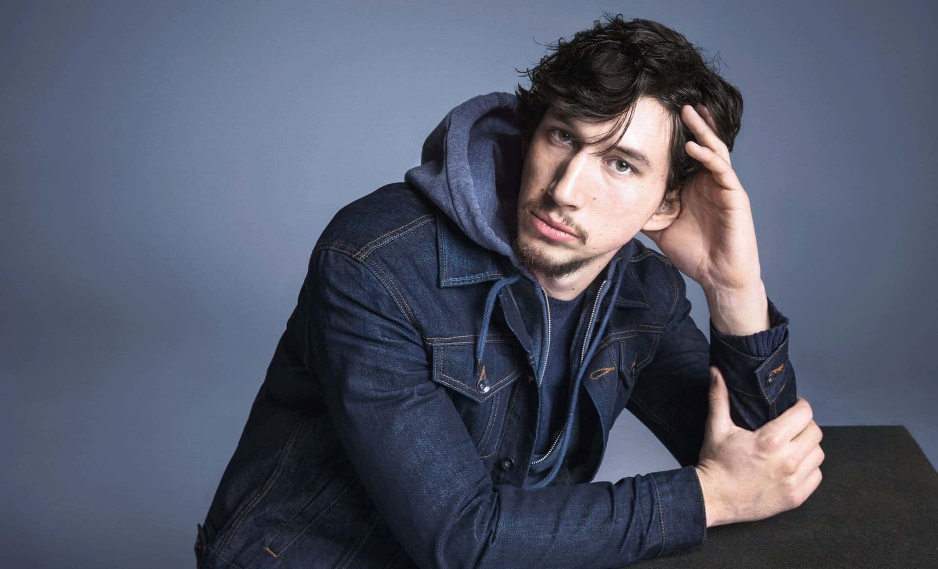 Portrait Photo of The American actor Adam Driver in blue outfit
