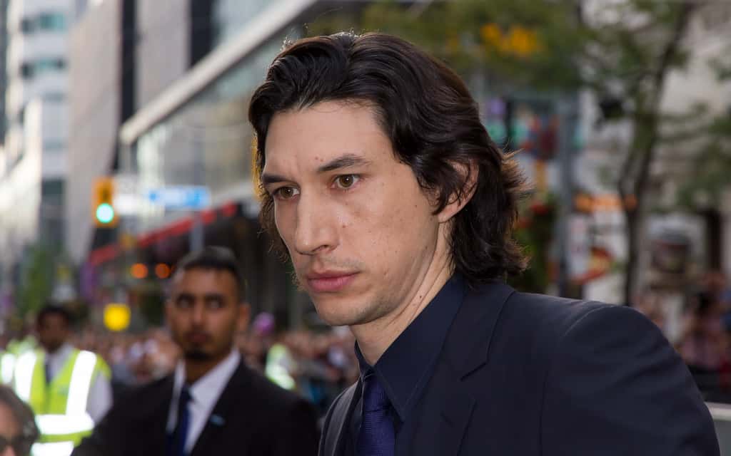 Portrait Photo of The American actor Adam Driver in dark outfit
