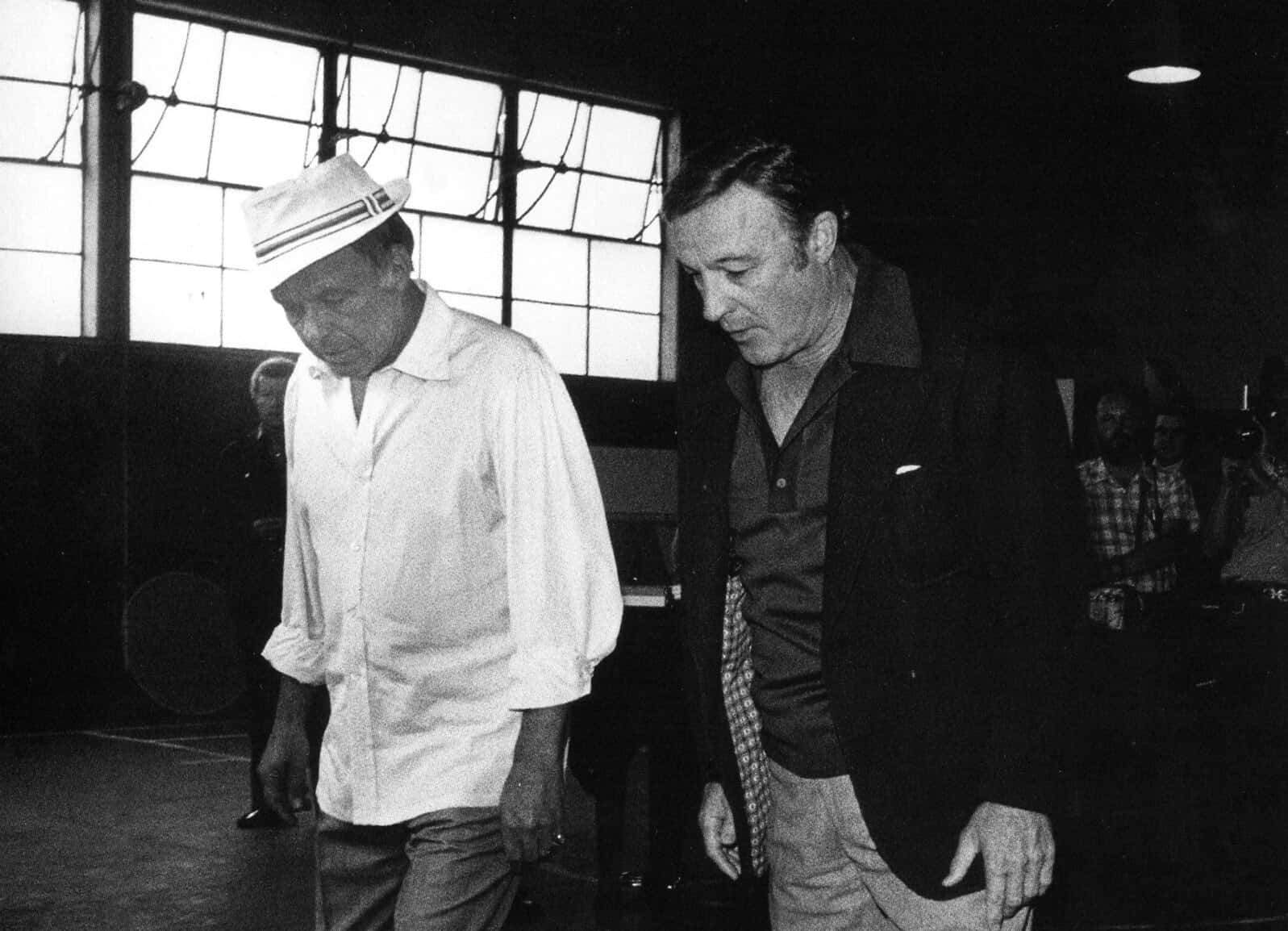 Frank Sinatra and Gene Kelly in black and white clothes