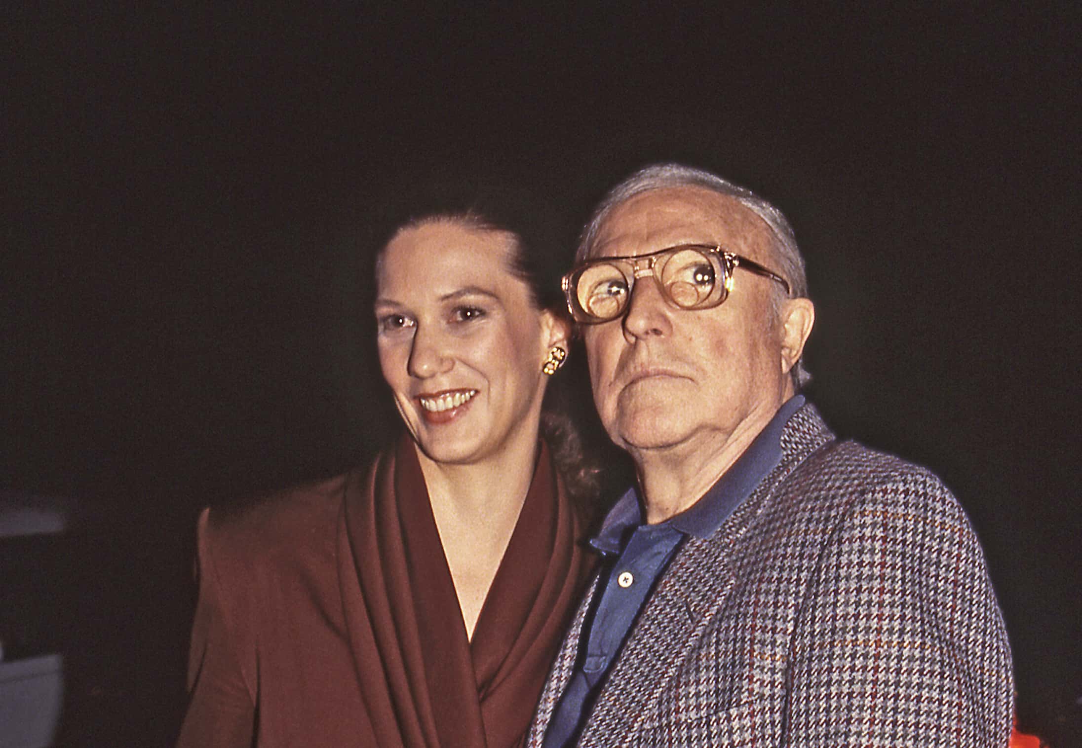 Gene Kelly with wife Patricia Ward, arriving at a formal celebrity event