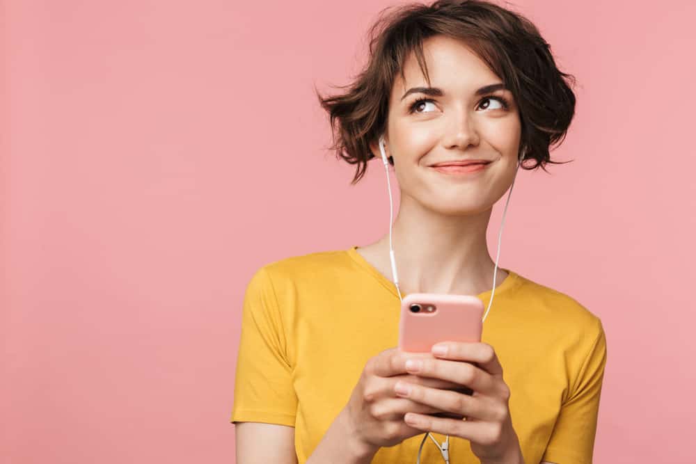 Happy woman listening music