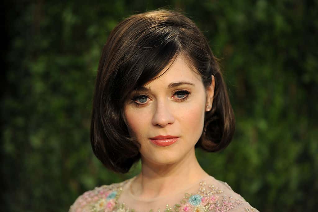 Actress Zooey Deschanel arrives at the 2013 Vanity Fair Oscar Party at Sunset Tower on February 24, 2013 in West Hollywood