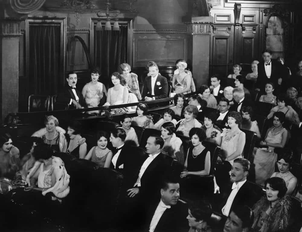 Graysale Photo of Audience sitting in rows and on balcony