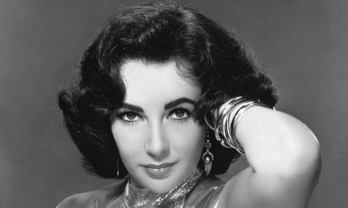 Grayscale Portrait Photo of the American Actress Elizabeth Taylor in a publicity photo by MGM